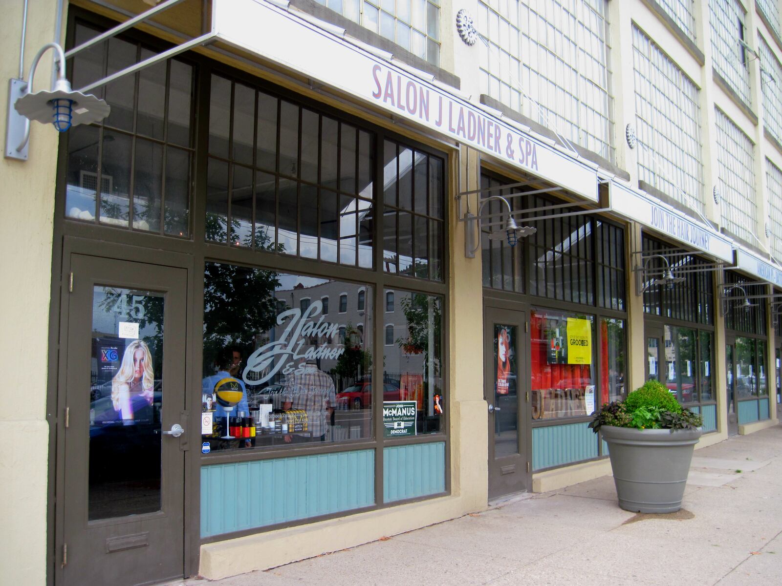 The storefront of Salon J. Ladner and Spa, which is now open and ready for business in their new space at 45 St. Clair Ave, just a few spaces down from their former location but over four times bigger and with new services. Book a hair cut and color, manicure, facial, waxing or massage at salonjladner.com. VIVIENNE MACHI / STAFF