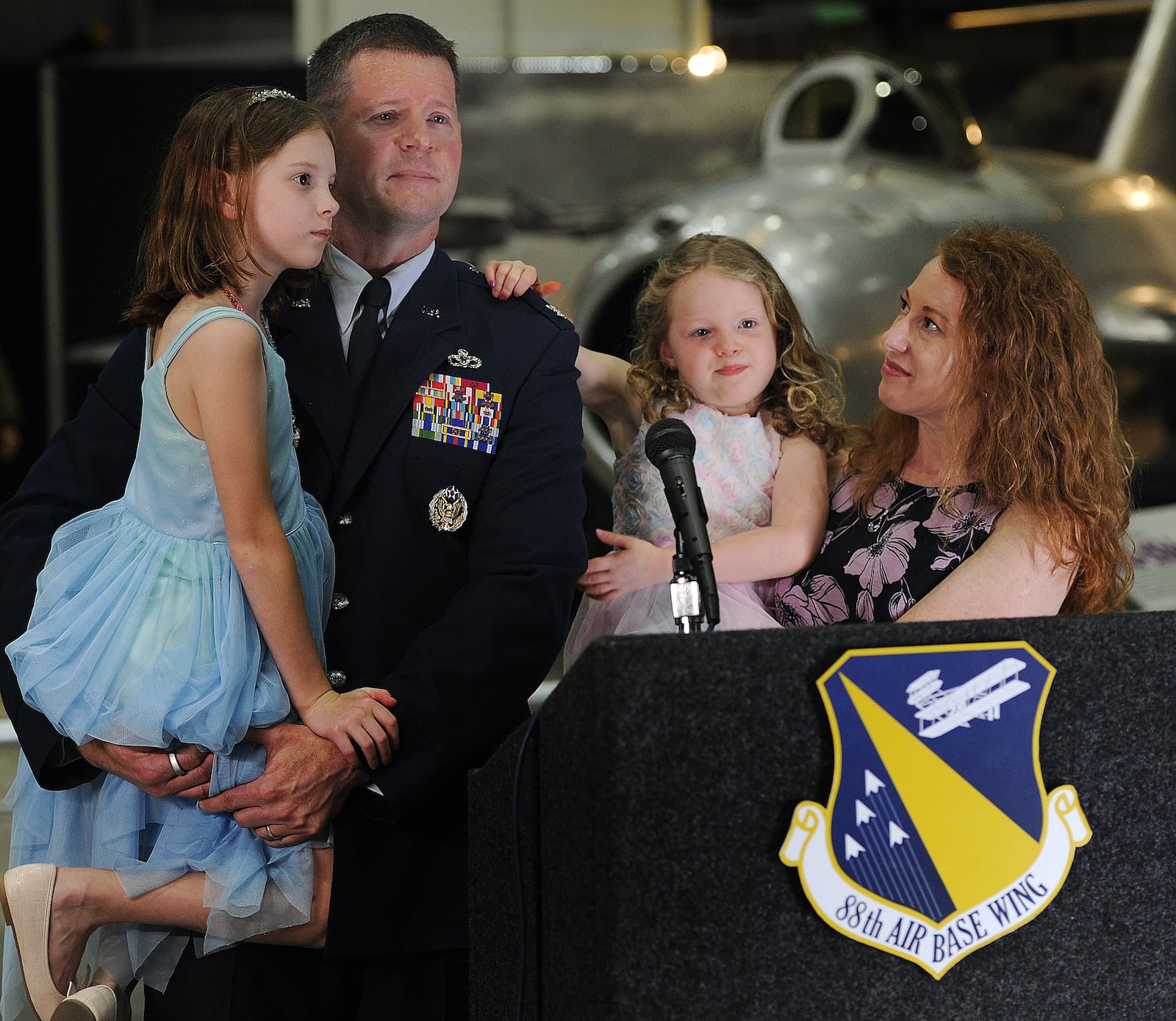 Colonel Dustin C. Richards, addresses the media with his family after becoming the new commander of the 88th Air Base Wing, Tuesday, April 9, 2024 at the National Museum of the United States Force. MARSHALL GORBY\STAFF