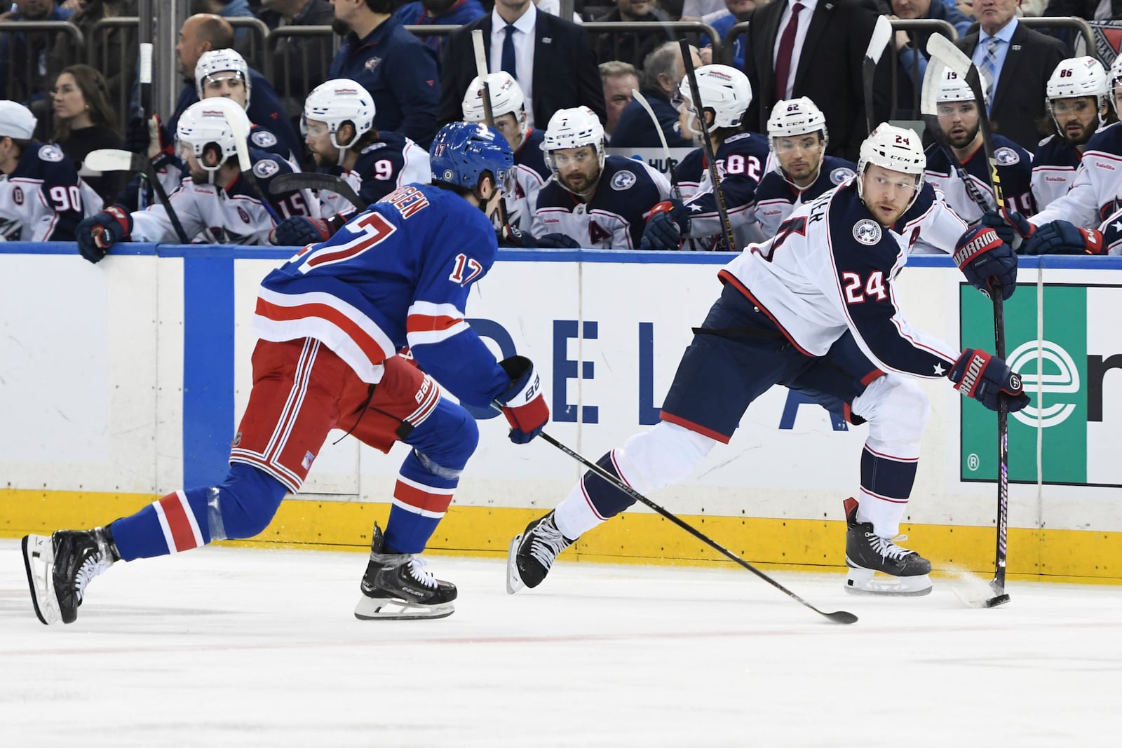 Columbus Blue Jackets' Mathieu Olivier, right, skates with the puck against New York Rangers' Will Borgen, left, during the first period of an NHL hockey game Saturday, Jan. 18, 2025, in New York. (AP Photo/Pamela Smith)