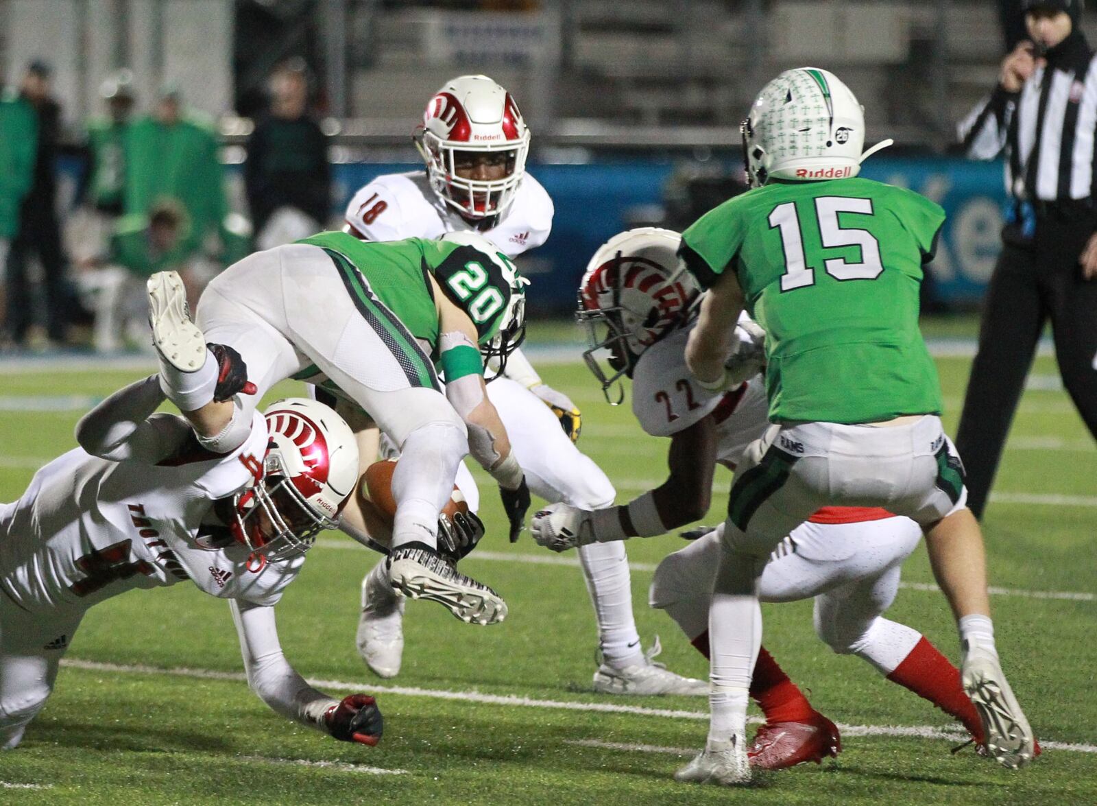 Alex DeLong of Badin (with ball) is upended. Trotwood-Madison defeated Badin 20-7 in a D-III, Region 12 high school football final at Miamisburg on Friday, Nov. 22, 2019. MARC PENDLETON / STAFF