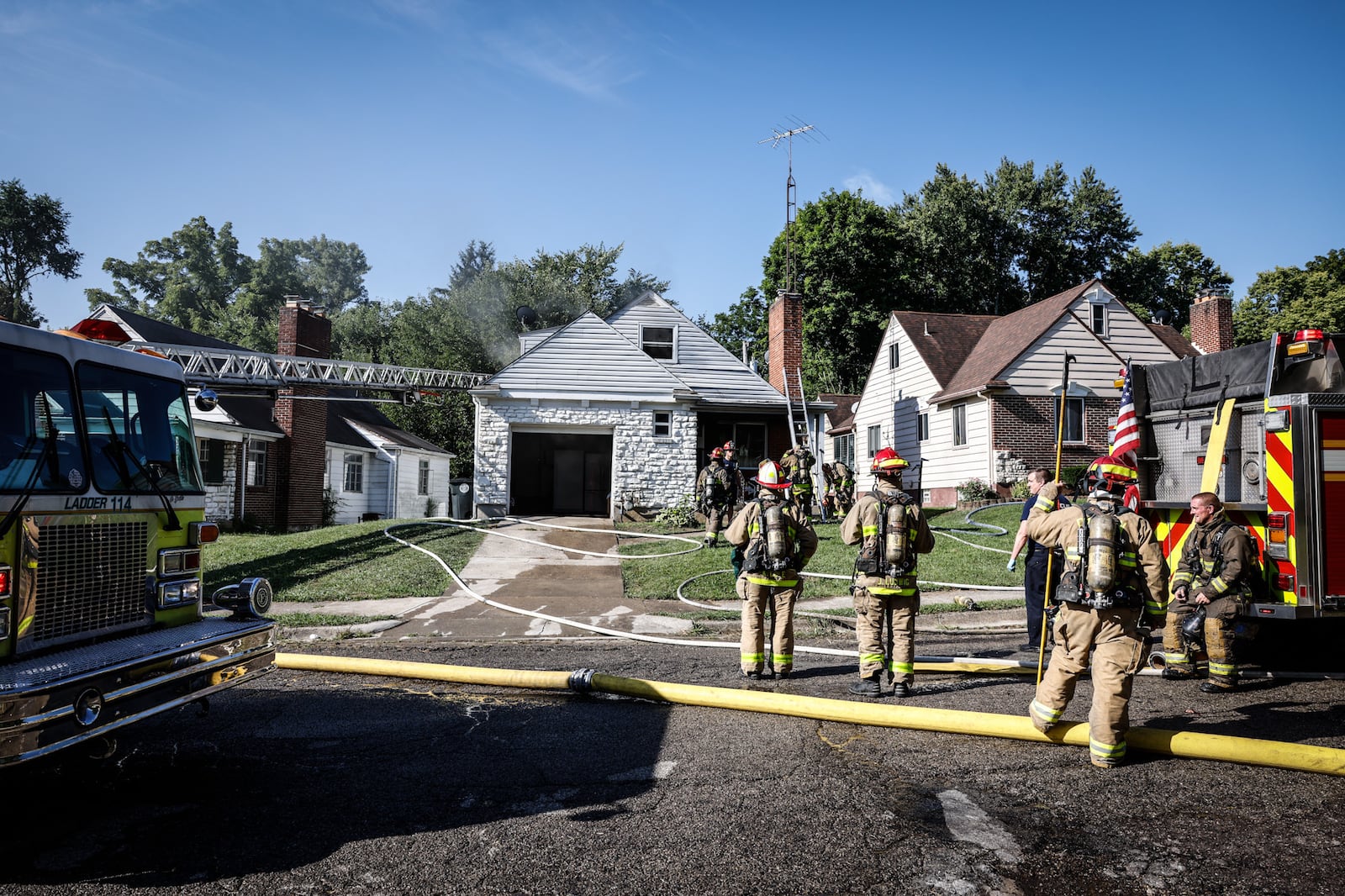 Dayton firefighters responded to two house fires at the same Rockcliff Circle home on Thursday, Aug. 18, 2022. JIM NOELKER / STAFF