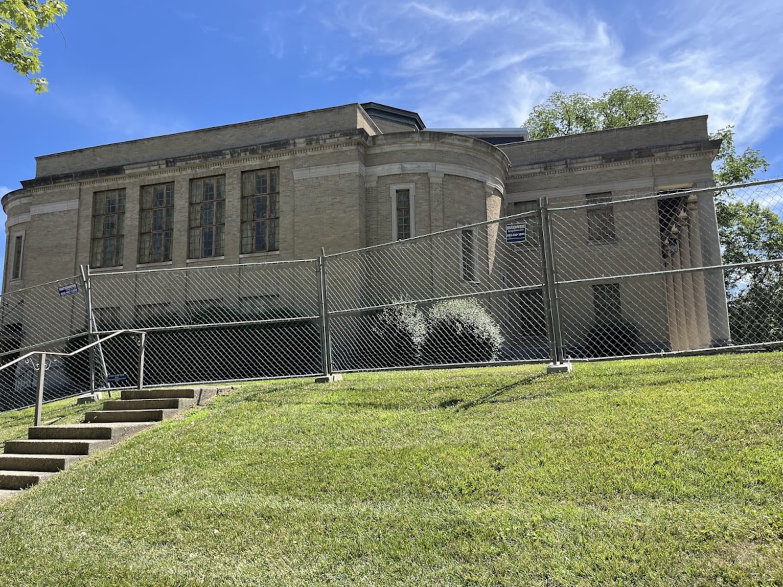 The former church was being fenced off at 105 Sawmill Road in south Dayton Tuesday. The city of Dayton has issued a commercial wrecking permit for the site. THOMAS GNAU/STAFF