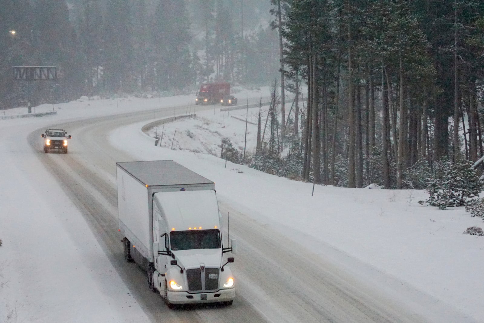 Traffic makes its way along I-80 during a snow storm Wednesday, Nov. 20, 2024, in Truckee, Calif. (AP Photo/Brooke Hess-Homeier)