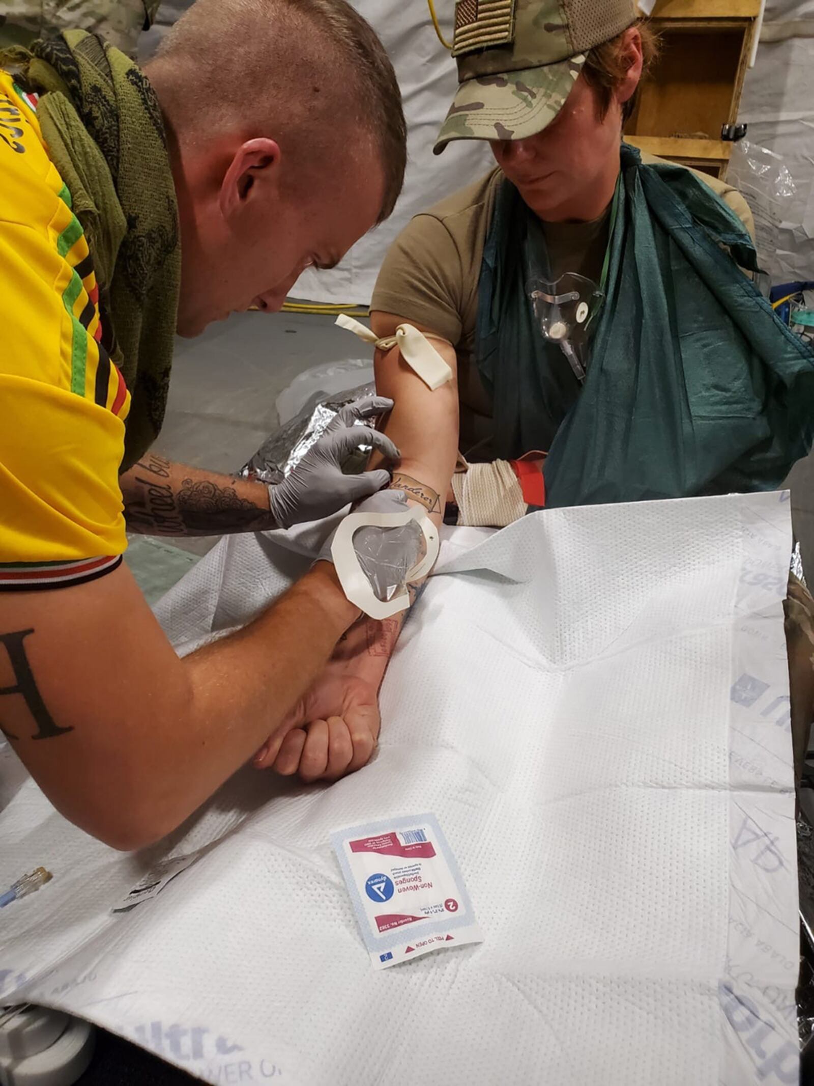 Capt. Stephen LeSage draws a sample for bloodwork July 22 while on deployment to Kenya as part of an AFRICOM mission. CONTRIBUTED PHOTO