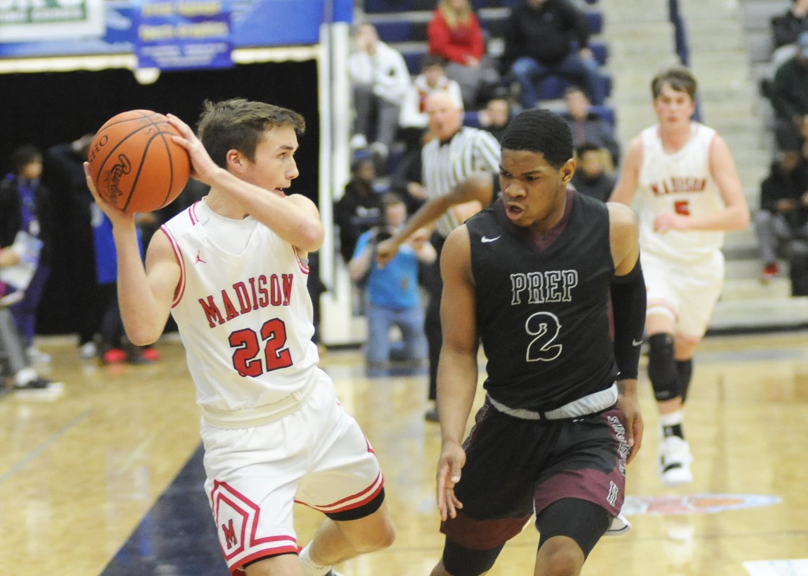 Madison's Jake Phelps is confronted by Canal Winchester Harvest Prep's Christopher Anthony during Monday night's Premier Health Flyin' to the Hoop at Fairmont's Trent Arena. Harvest Prep won 79-56. MARC PENDLETON/STAFF