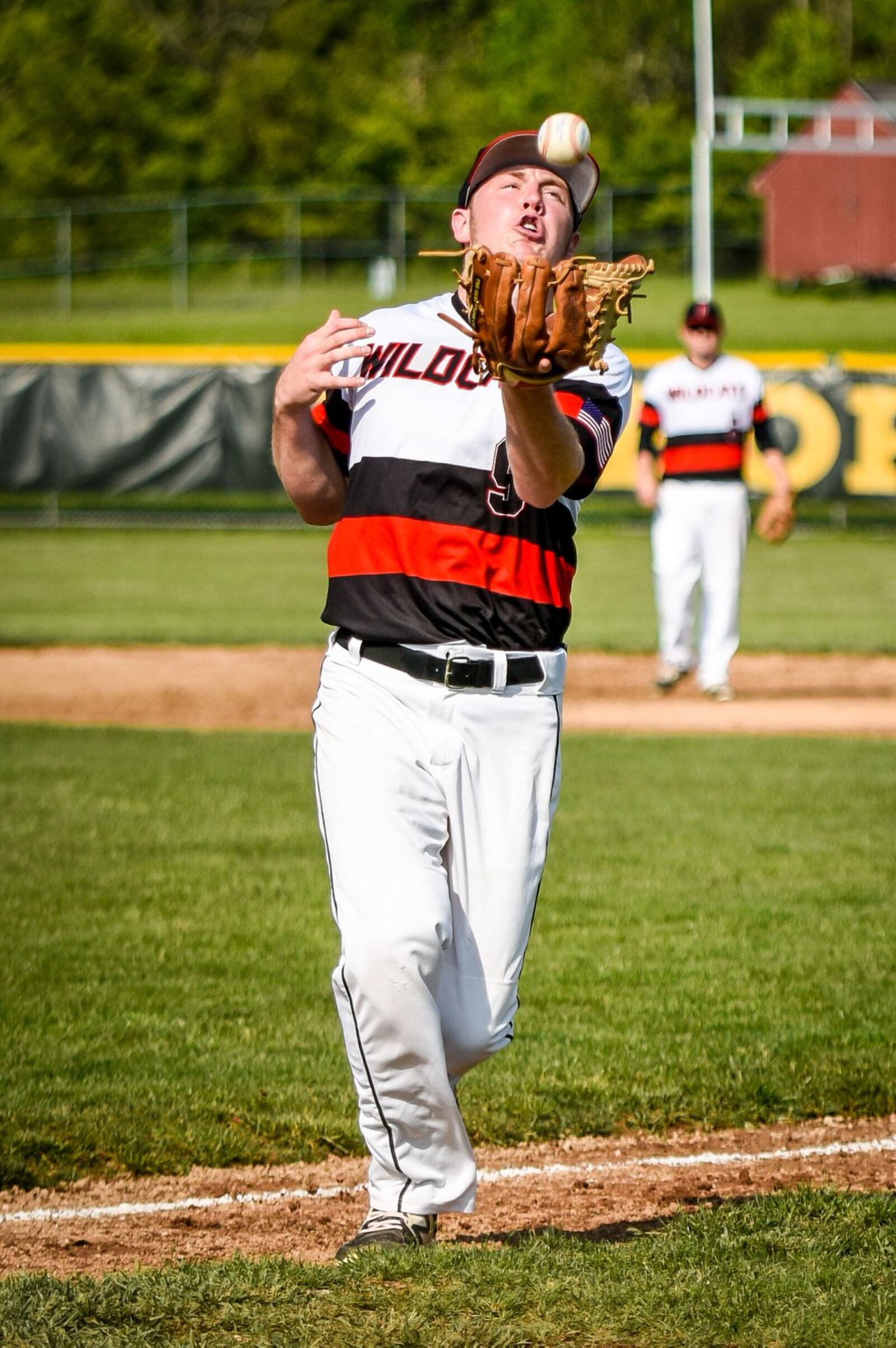 Franklin’s Konnor Black catches a pop-up during a 1-0 loss to Fenwick in a Division II sectional game on May 10, 2017, at Fenwick. NICK GRAHAM/STAFF