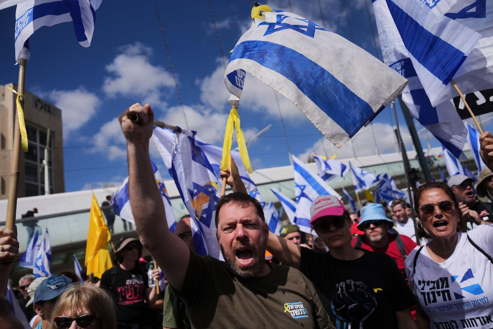 Israelis march in a protest against Prime Minister Benjamin Netanyahu and his plans to dismiss the head of the Shin Bet internal security service, on Wednesday, March 19, 2025. (AP Photo/Ohad Zwigenberg)