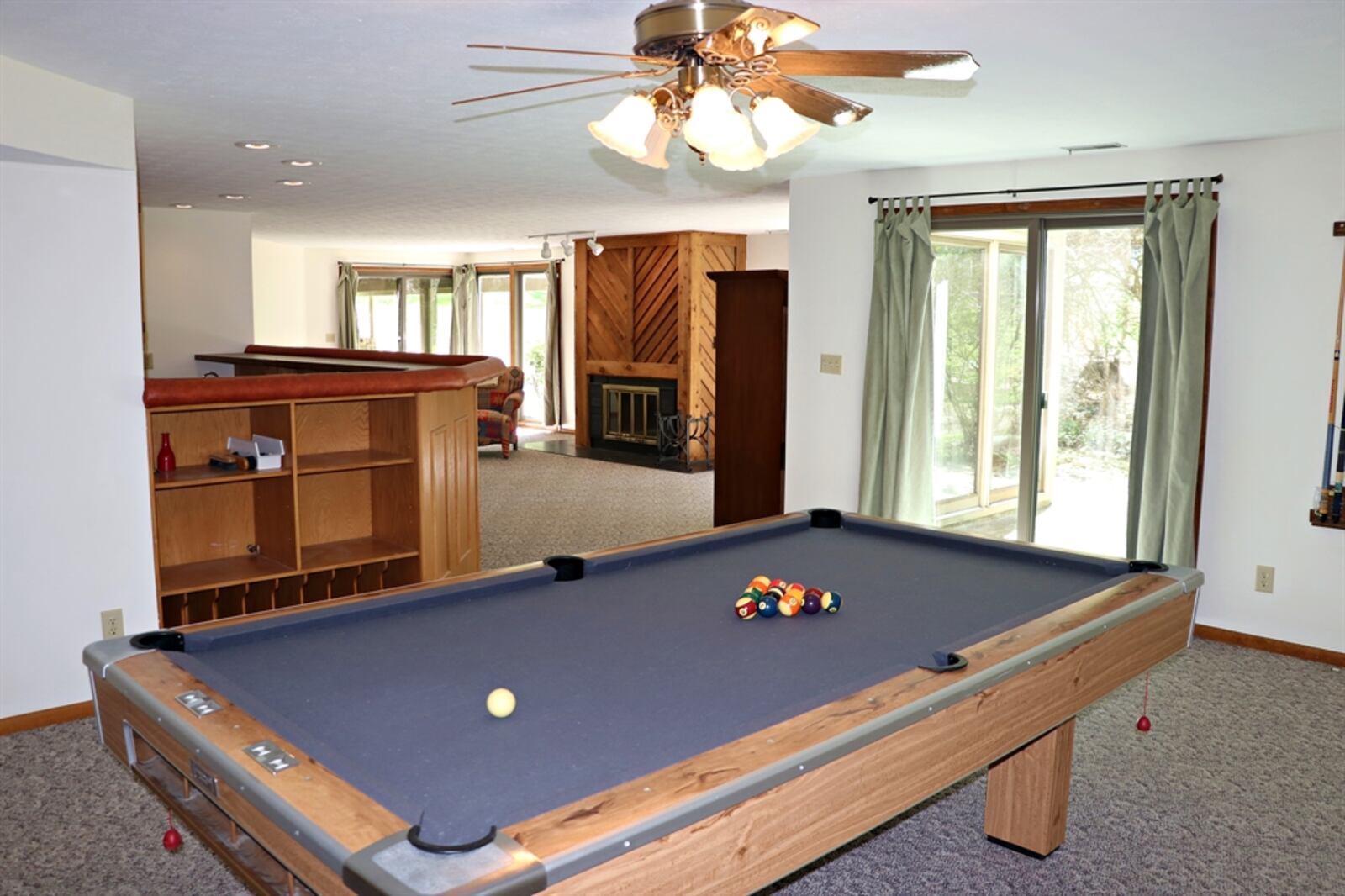 Filled with natural light, as most of the windows are floor-to-ceiling, the lower level has a family room with fireplace, billiards room and a recreation room with a 12-seat wet bar.