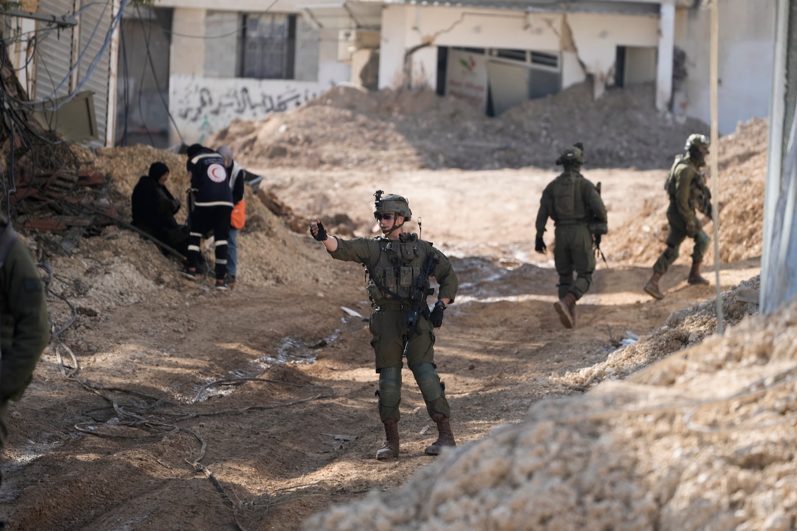 Israeli soldiers are seen during an army operation in the West Bank urban refugee camp of Nur Shams on Wednesday, Feb. 26, 2025. (AP Photo/Majdi Mohammed)