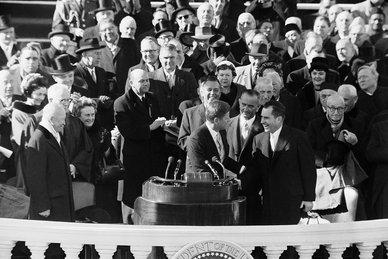 FILE - Former Vice President Richard Nixon shakes hands with President John F. Kennedy at the end of Kennedy's inauguration, in Washington, June 20, 1961. (AP Photo, File)