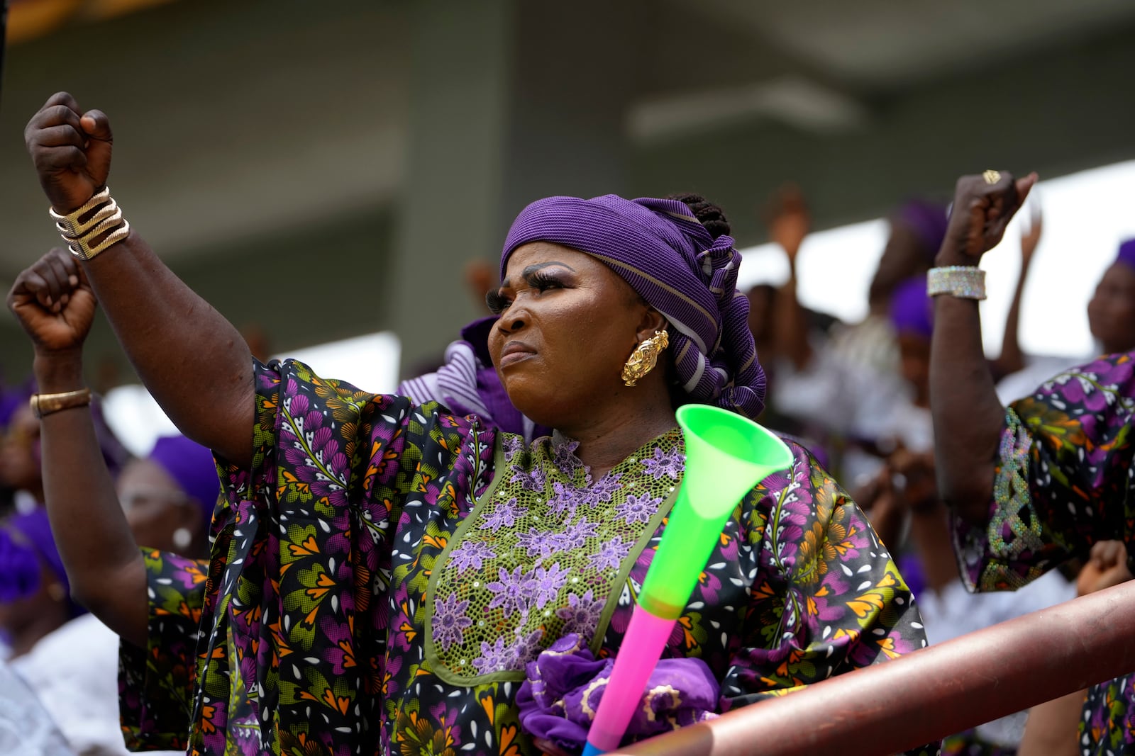 A woman attends the International Women's Day celebration at the Mobolaji Johnson Stadium in Lagos, Nigeria, Friday, March. 7, 2025. (AP Photo/Sunday Alamba)