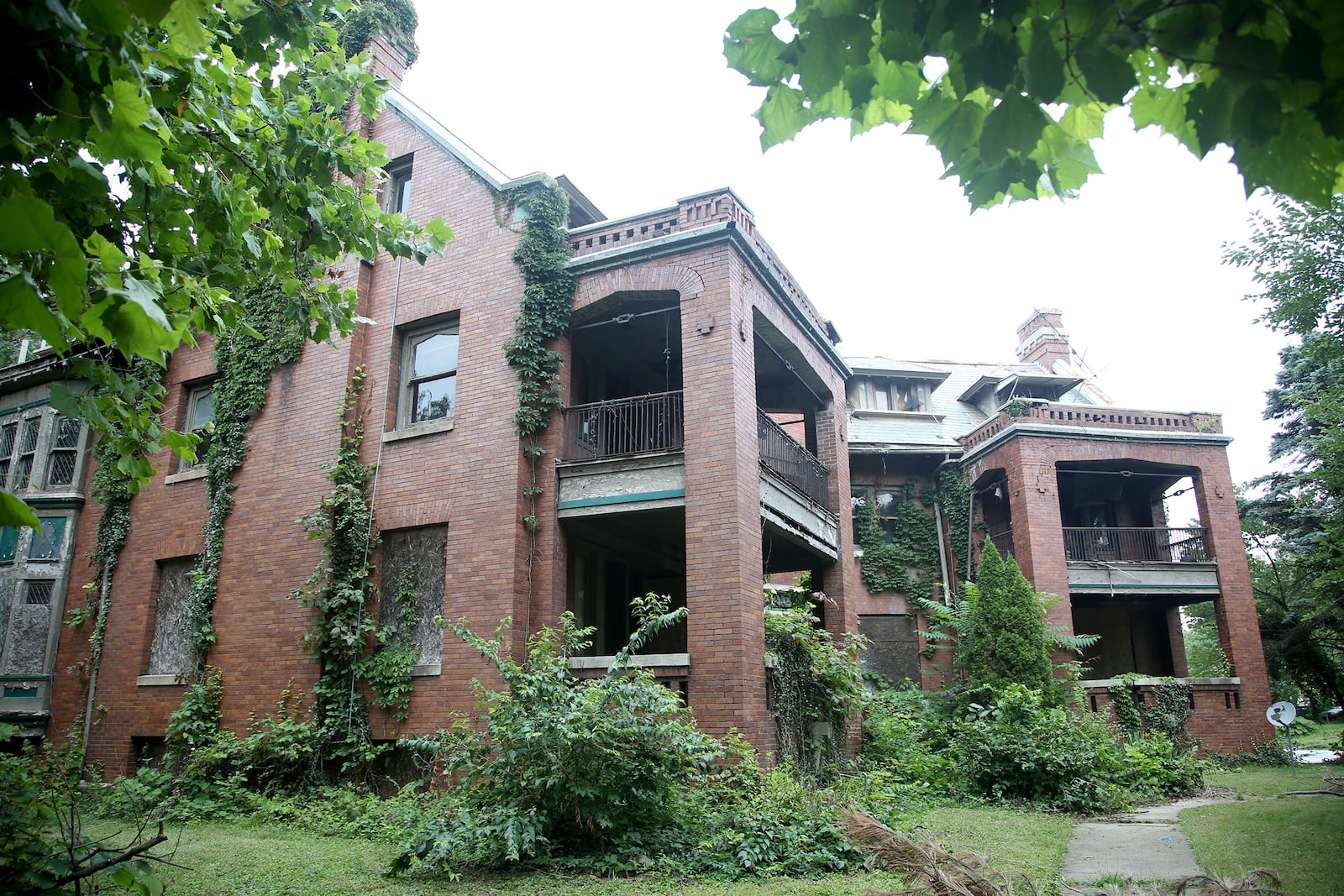 This three-story, Jacobethan influenced brick apartment building in the Dayton View Historic District was built in 1908 for John N. Van Deman, a Dayton lawyer.
When built, the building contained five very large apartments, four of which had servant’s rooms and large front porches. The interior is finished in mahogany and oak. LISA POWELL / STAFF

