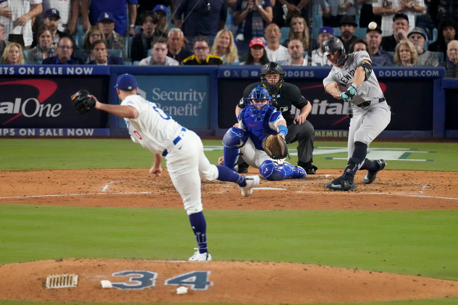 New York Yankees' Giancarlo Stanton connects for a two-run home off Los Angeles Dodgers starting pitcher Jack Flaherty during the sixth inning in Game 1 of the baseball World Series, Friday, Oct. 25, 2024, in Los Angeles. (AP Photo/Mark J. Terrill)