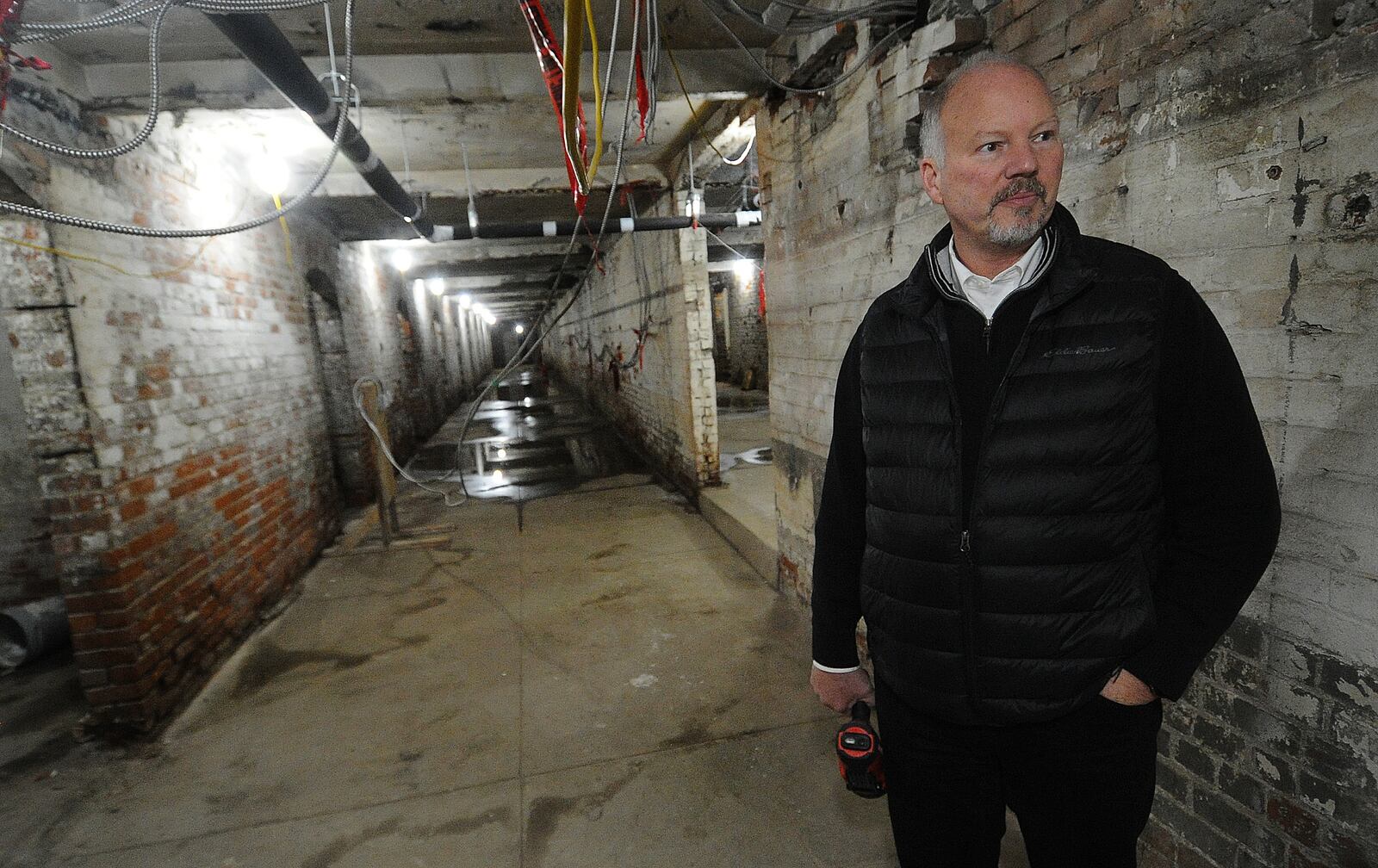 Dave Williams, of Cross Street Partners, talks about work being done on phase 2 of the Dayton Arcade.  MARSHALL GORBY\STAFF