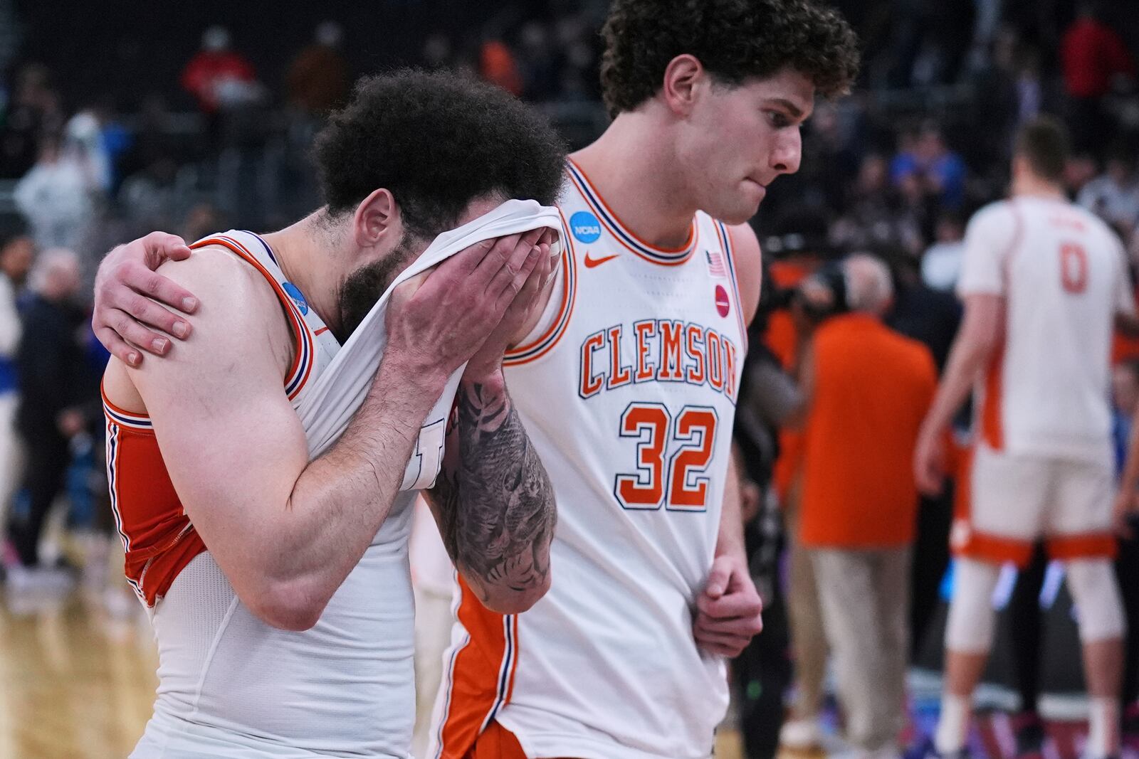 Clemson guard Jaeden Zackery, left, react after a loss to McNeese State in the first round of the NCAA college basketball tournament, Thursday, March 20, 2025, in Providence, R.I. (AP Photo/Charles Krupa)