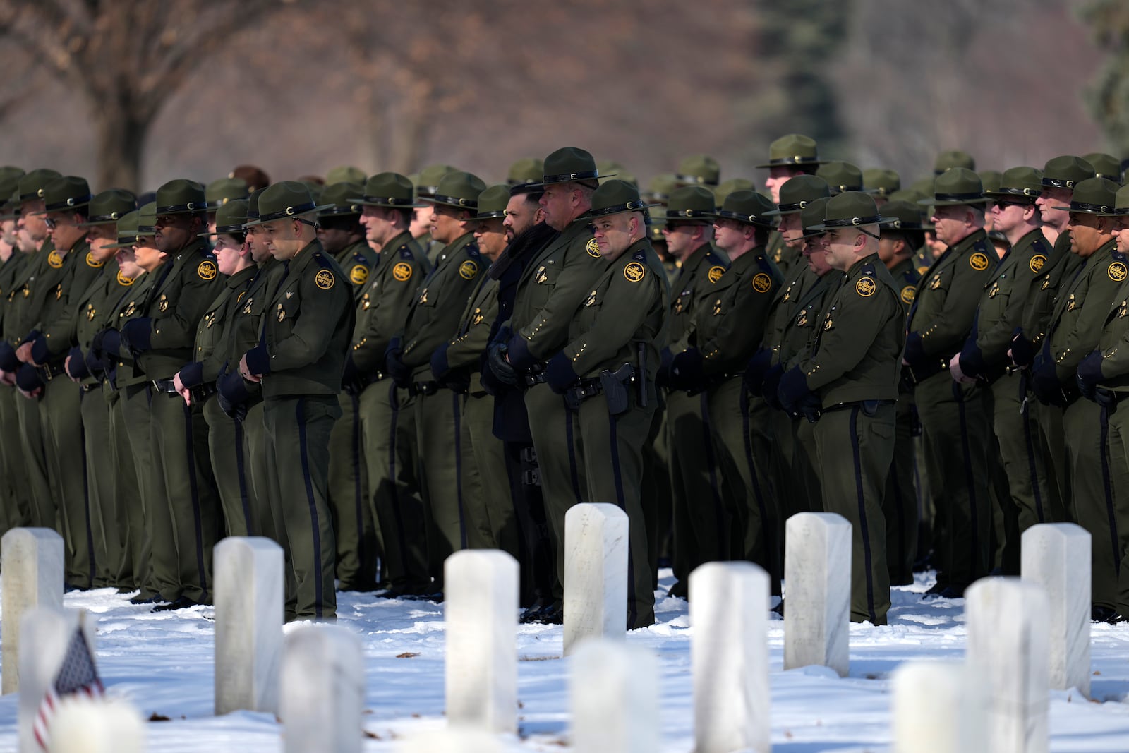 U.S. Border Patrol members attend the service for U.S. Border Patrol agent David Maland to be recognized with military honors before his burial at Fort Snelling National Cemetery in Minneapolis, on Saturday, Feb. 22, 2025. (AP Photo/Abbie Parr)