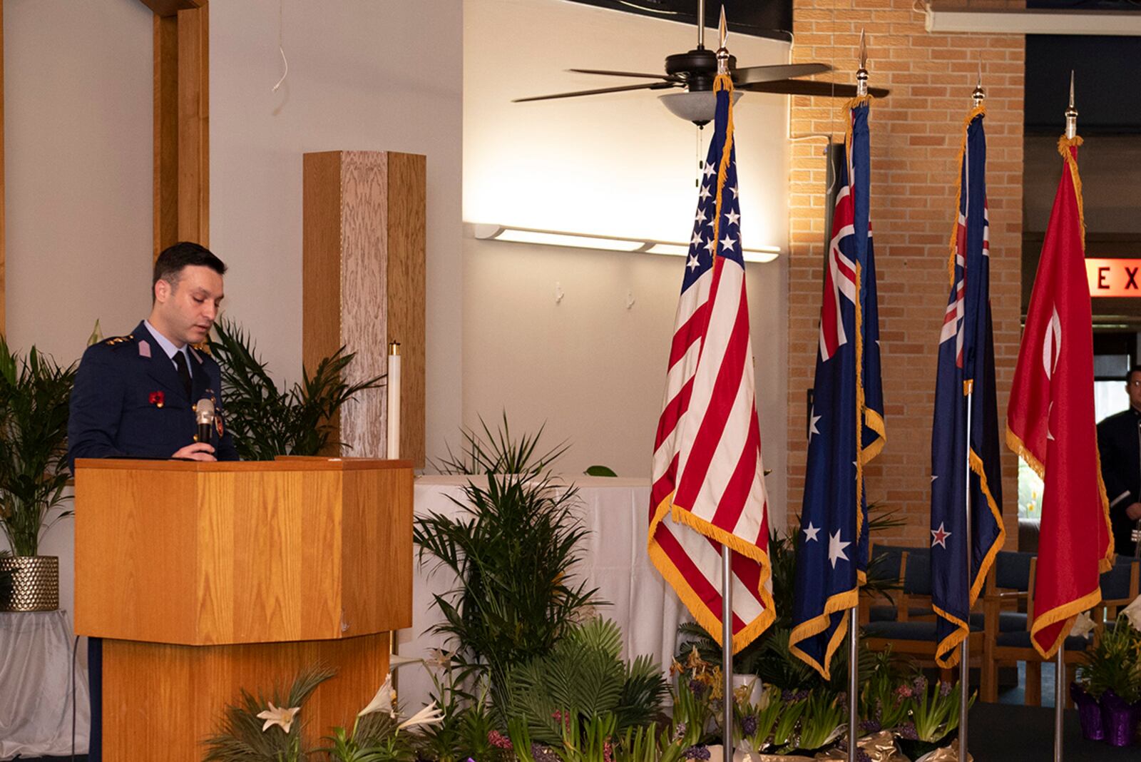 Turkish air force Capt. Onur Hoscan gives the Turkish address for the Anzac Day commemoration at the Prairies Chapel. U.S. AIR FORCE PHOTO/JAIMA FOGG