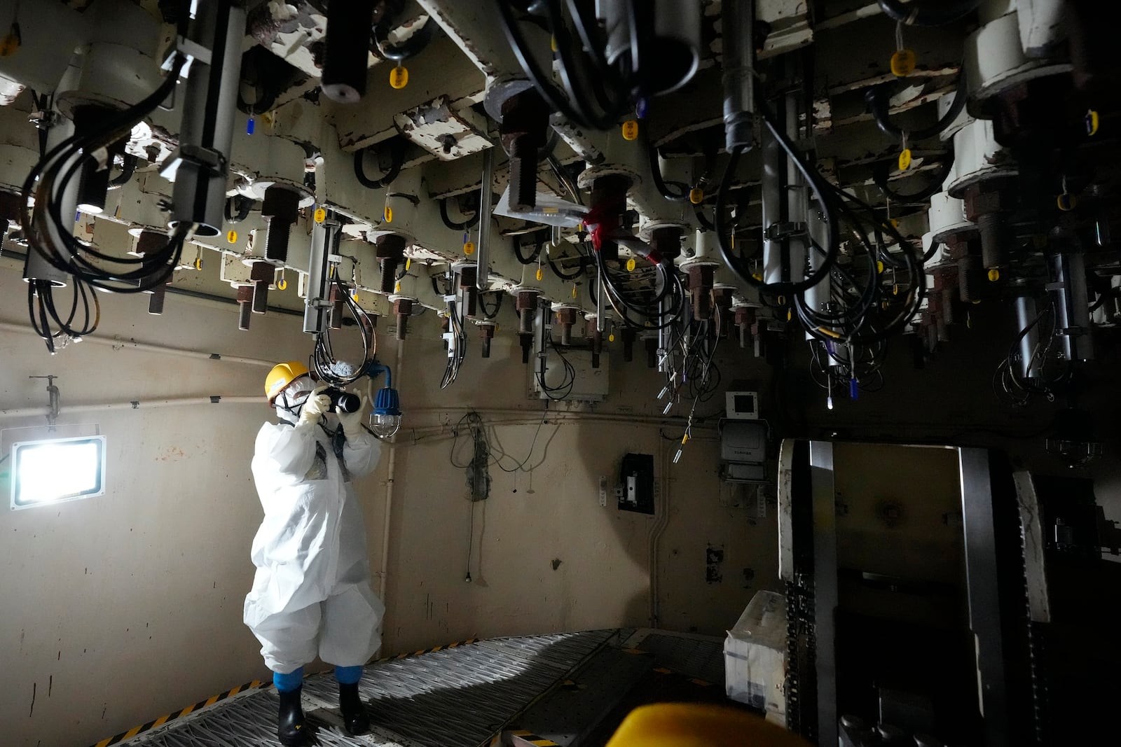 The area under the Unit 5 reactor pressure vessel, which survived the earthquake-triggered tsunami in 2011, is seen at the Fukushima Daiichi nuclear power plant is seen in Futaba town, northeastern Japan, on Monday Feb. 20, 2025. (AP Photo/Eugene Hoshiko)