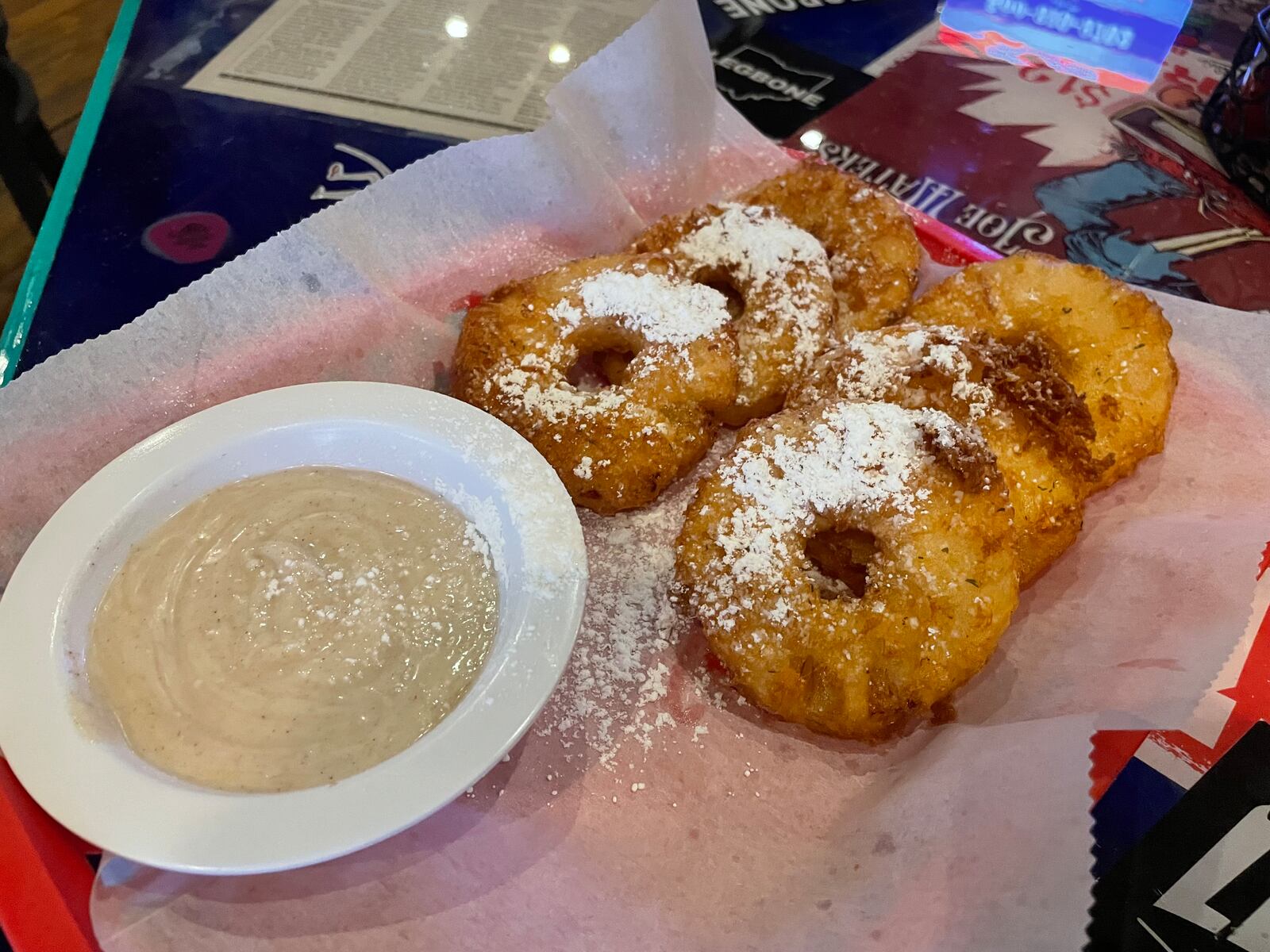 Blind Bob's, a family-owned tavern in Dayton’s Oregon District, has several unique appetizers and dishes customers can't get anywhere else. This includes hula hoops (pictured), which are beer battered, pineapple rings.