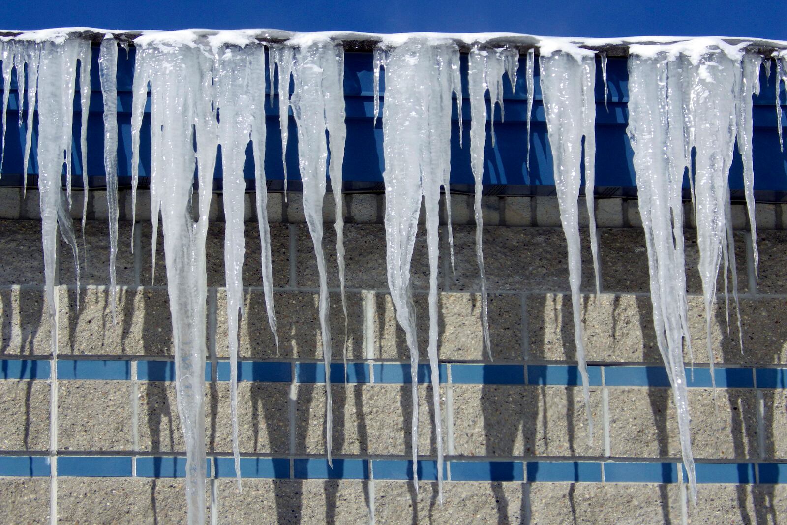 Icicles hang from Captain Jack's Liquor Land in Bismarck, N.D., on Tuesday, Feb. 18, 2025. (AP Photo/Jack Dura)