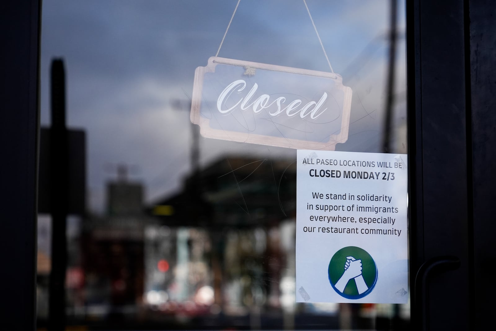 Paseo displays a sign stating the restaurant is closed for the day in solidarity to support the immigrant community, Monday, Feb. 3, 2025, in Seattle. (AP Photo/Lindsey Wasson)