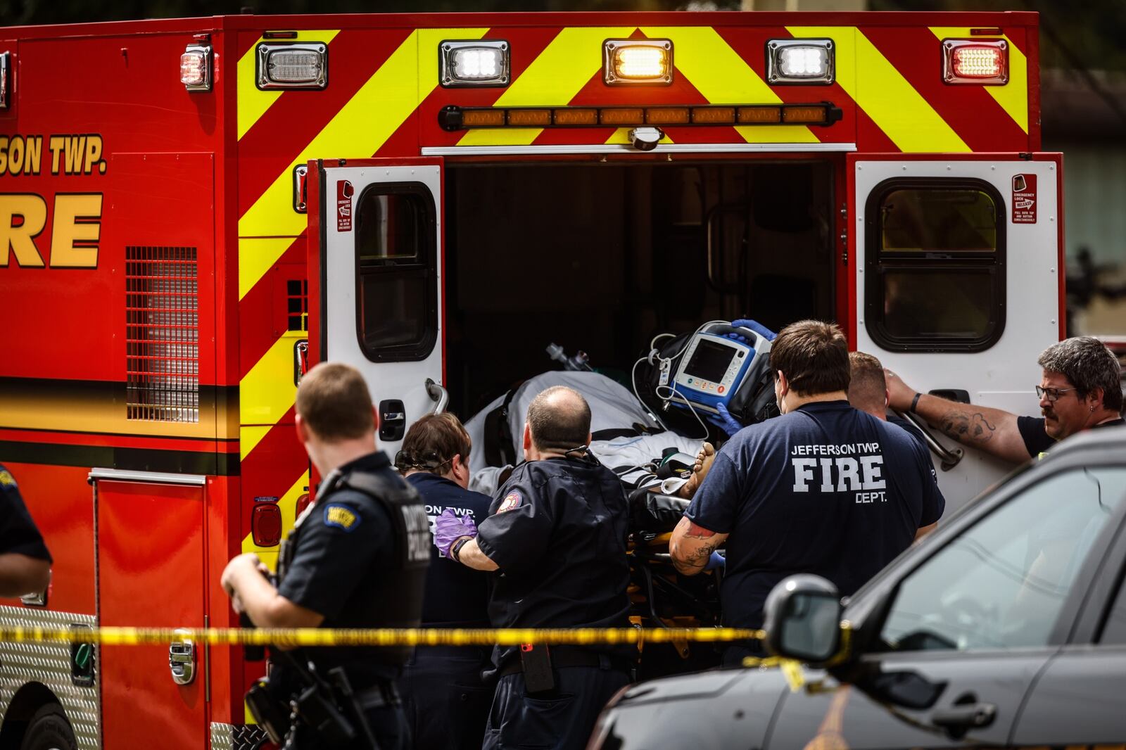 A shooting victim was loaded into a Jefferson Twp. ambulance Friday afternoon, Aug. 6, 2021, after the shooting reported inside a home in the 4900 block of Ericson Avenue. JIM NOELKER/STAFF