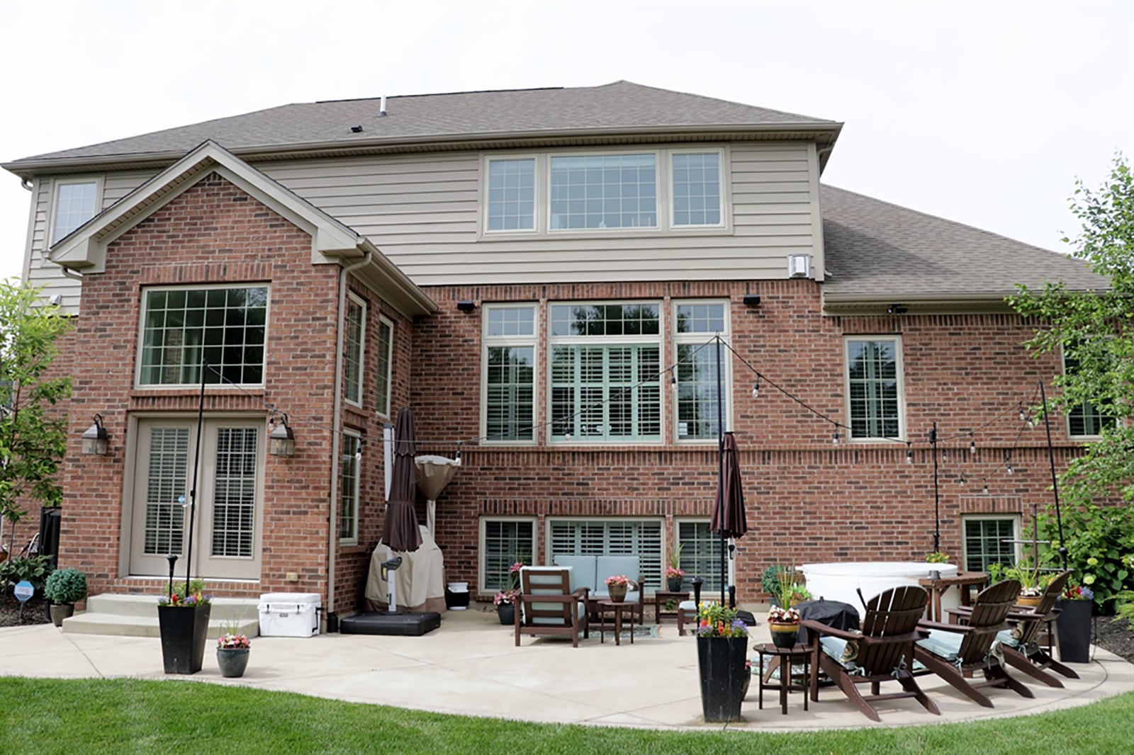 Between the breakfast room and great room is an open staircase that leads down to a landing where French doors open to a large back yard and patio. CONTRIBUTED PHOTO BY KATHY TYLER