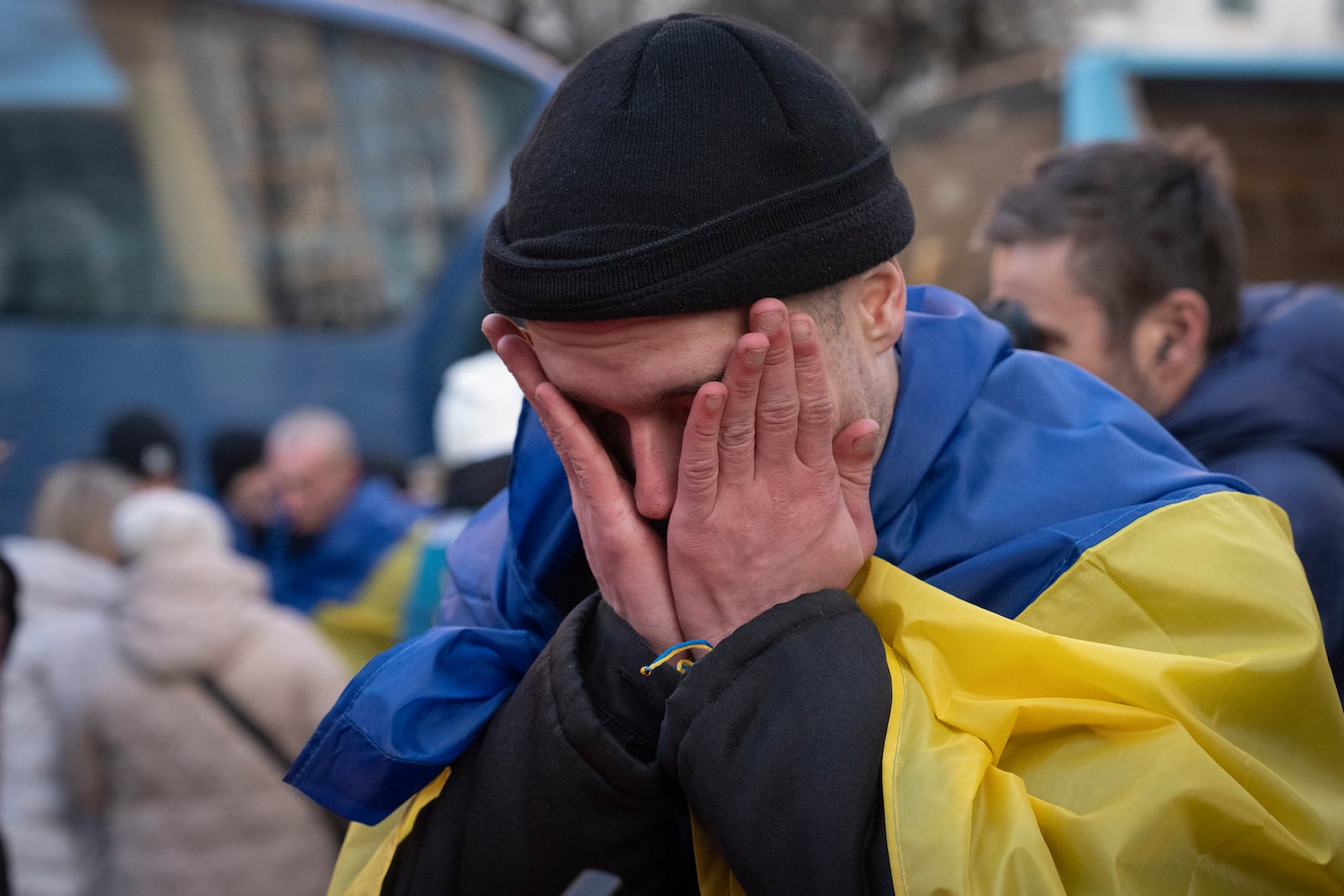 A Ukrainian serviceman reacts after returning from captivity during a POWs exchange between Russia and Ukraine, in Ukraine, Wednesday, March 19, 2025. (AP Photo/Efrem Lukatsky)