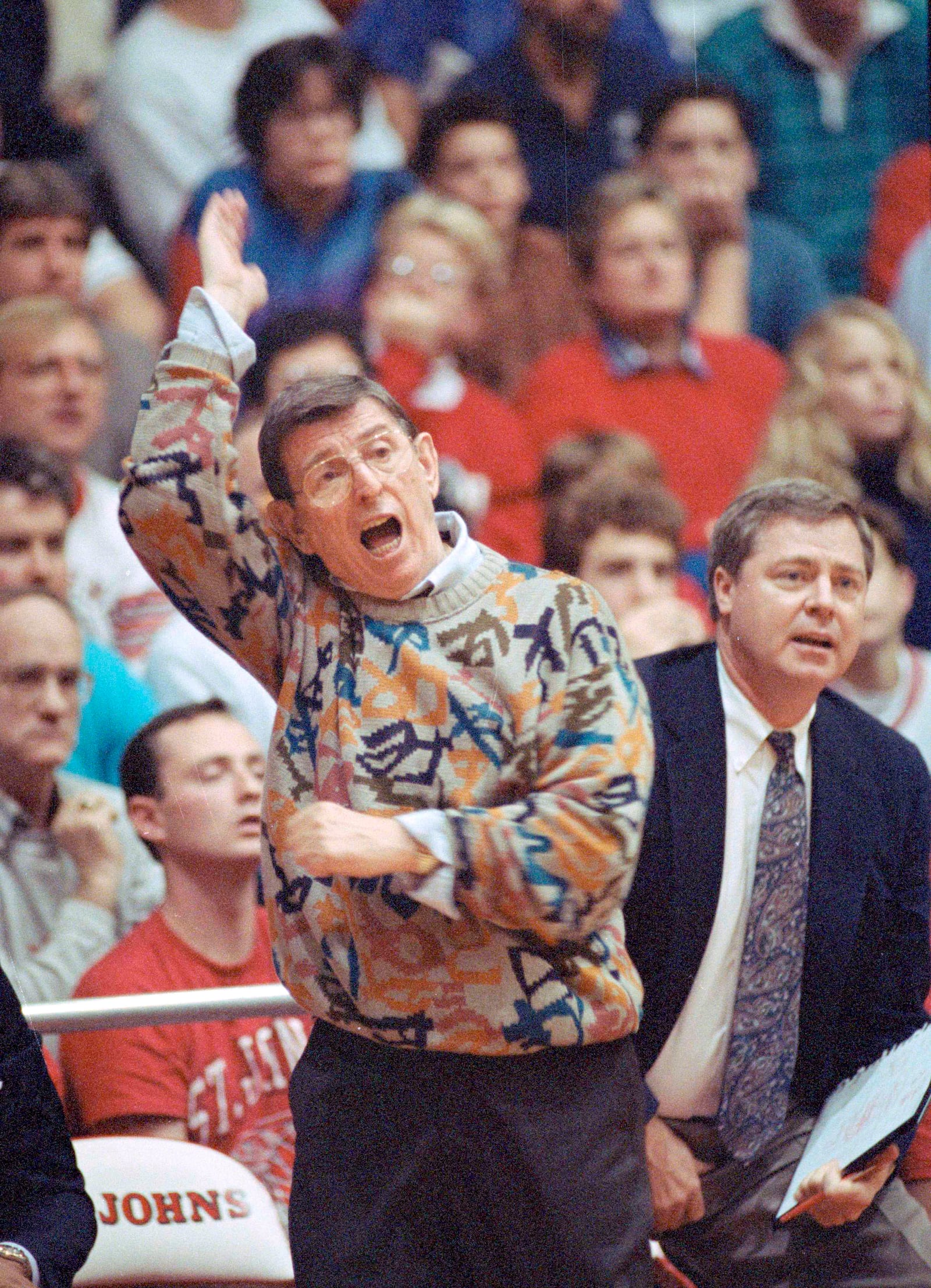 FILE - Lou Carnesecca coaches his St. John's team from the sidelines during their game against Niagara in New York, on Nov. 23, 1991. (AP Photo/Mark Lennihan, File)