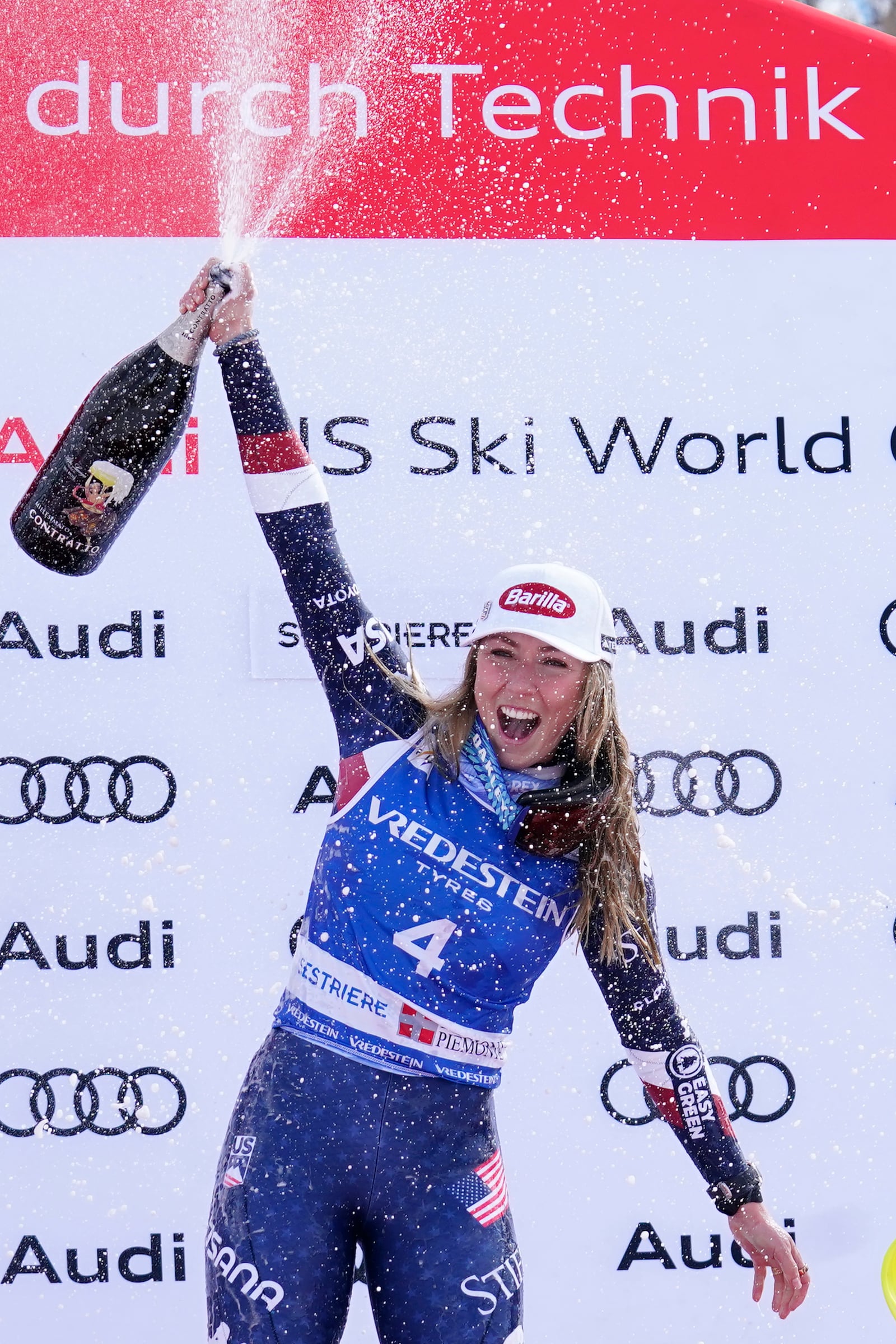 United States' Mikaela Shiffrin celebrates her 100th victory after an alpine ski, women's World Cup slalom, in Sestriere, Italy, Sunday, Feb. 23, 2025. (AP Photo/Piermarco Tacca)