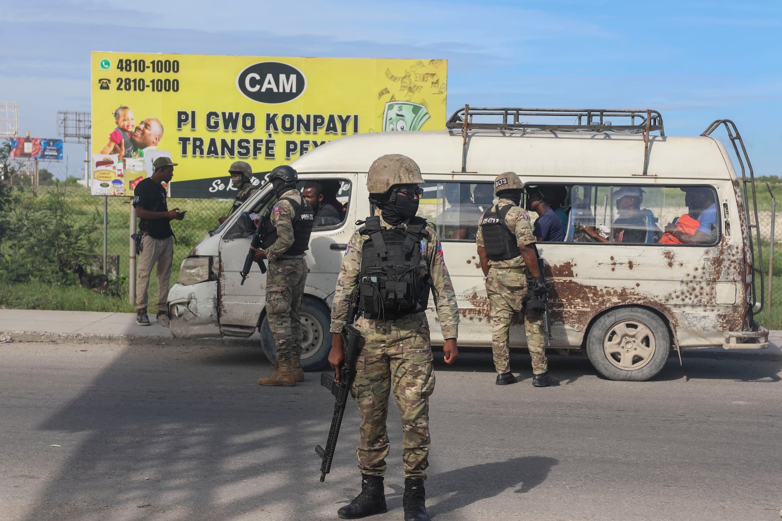 Police officers patrol near the Toussaint Louverture International Airport in Port-au-Prince, Haiti, Tuesday, Nov. 12, 2024. (AP Photo/Odelyn Joseph)