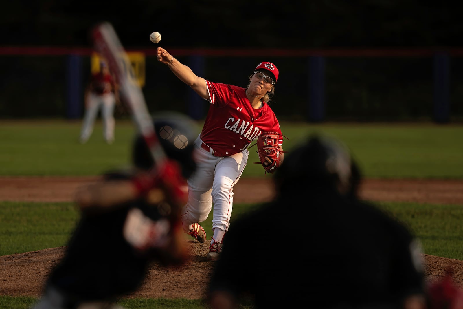 Allison Schroder #16 of Team Canada pitches during a WBSC Women's Baseball World Cup exhibition game against Team USA at Baseball Central on Friday, July 26, 2024 in Thunder Bay, Ontario. (Jean Fruth via AP)