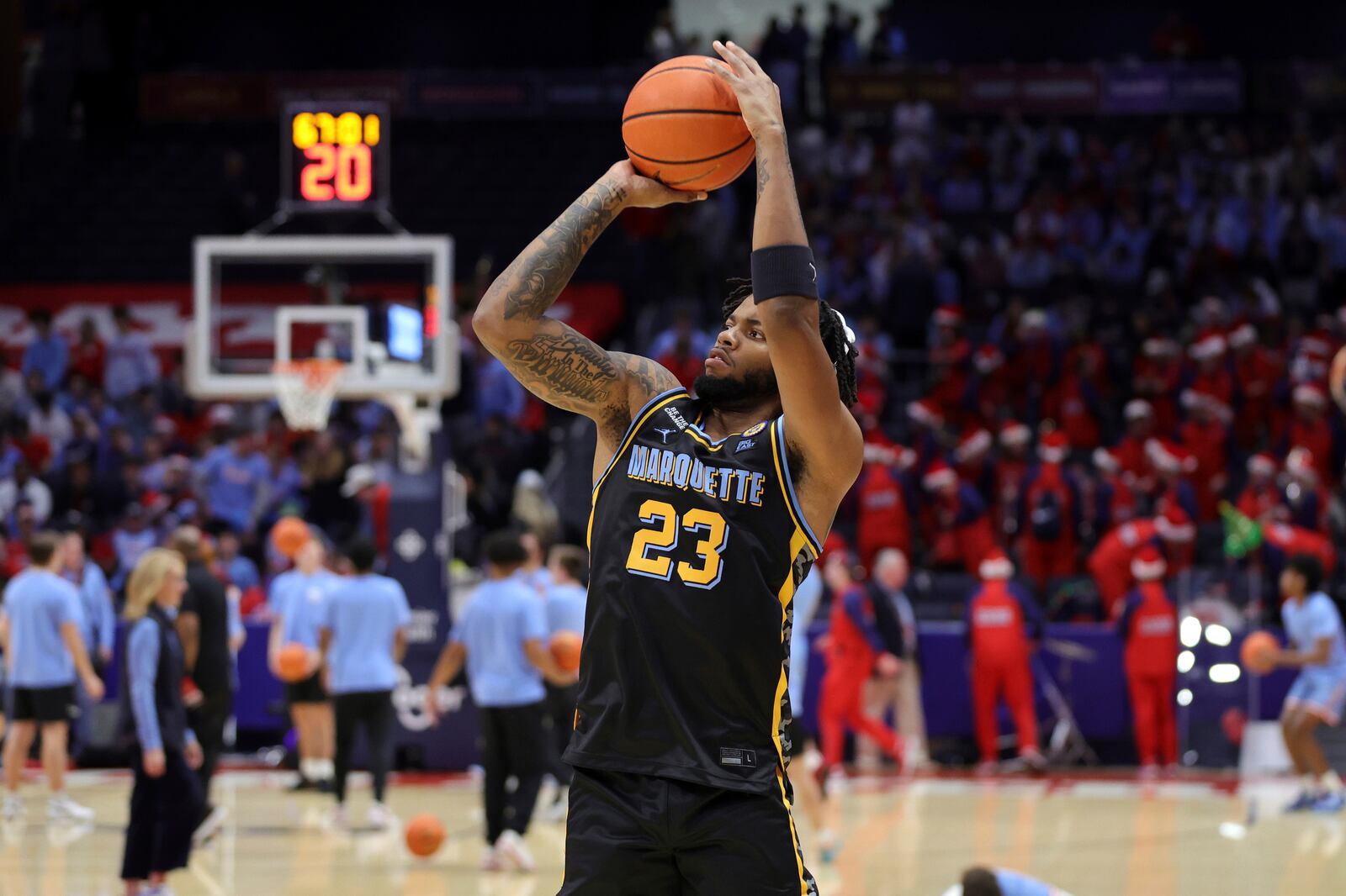 Marquette forward David Joplin warms up before an NCAA college basketball game against Dayton in Dayton, Ohio, Saturday, Dec. 14, 2024. (AP Photo/Paul Vernon)