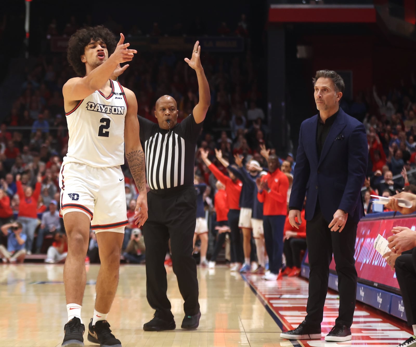 Dayton's Nate Santos reacts after making a 3-pointer in the first half against Saint Joseph’s on Friday, Jan. 24, 2025, at UD Arena. David Jablonski/Staff