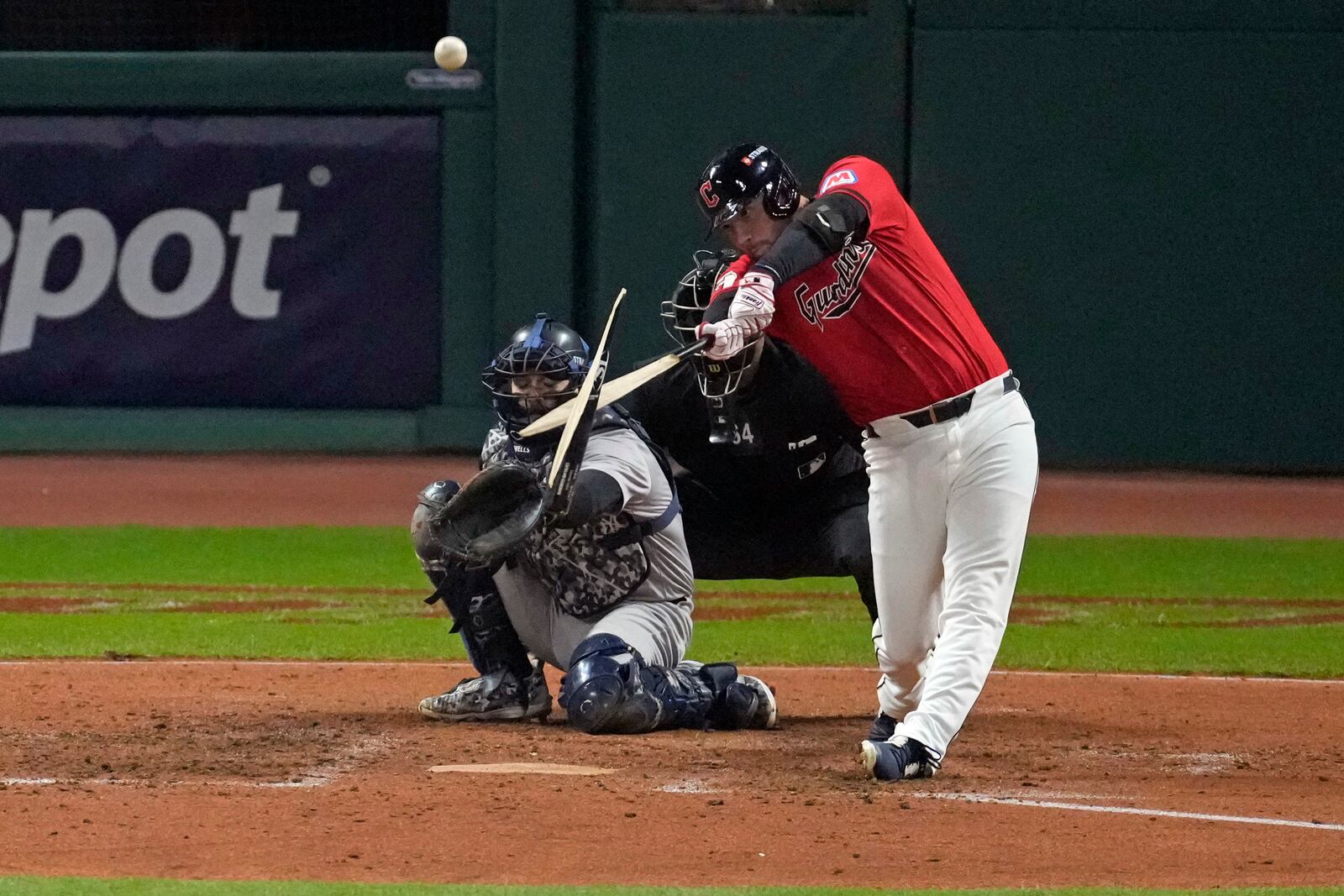 Cleveland Guardians' David Fry breaks his bat while hitting a single against the New York Yankees during the fifth inning in Game 5 of the baseball AL Championship Series Saturday, Oct. 19, 2024, in Cleveland. (AP Photo/Jeff Roberson)