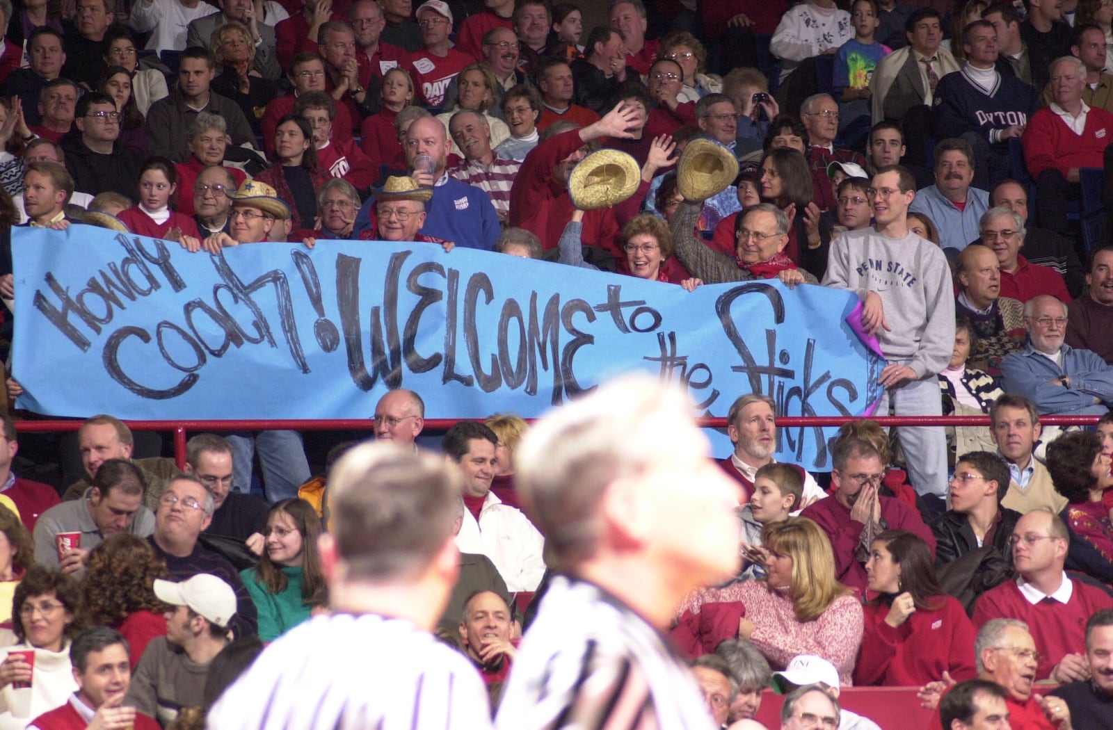 Students in the Red Scare section hold up a sign during a game referencing Temple coach John Chaney's "in the sticks" comment about Dayton at UD Arena on Feb. 27, 2002. Photo courtesy of Greg Popham II