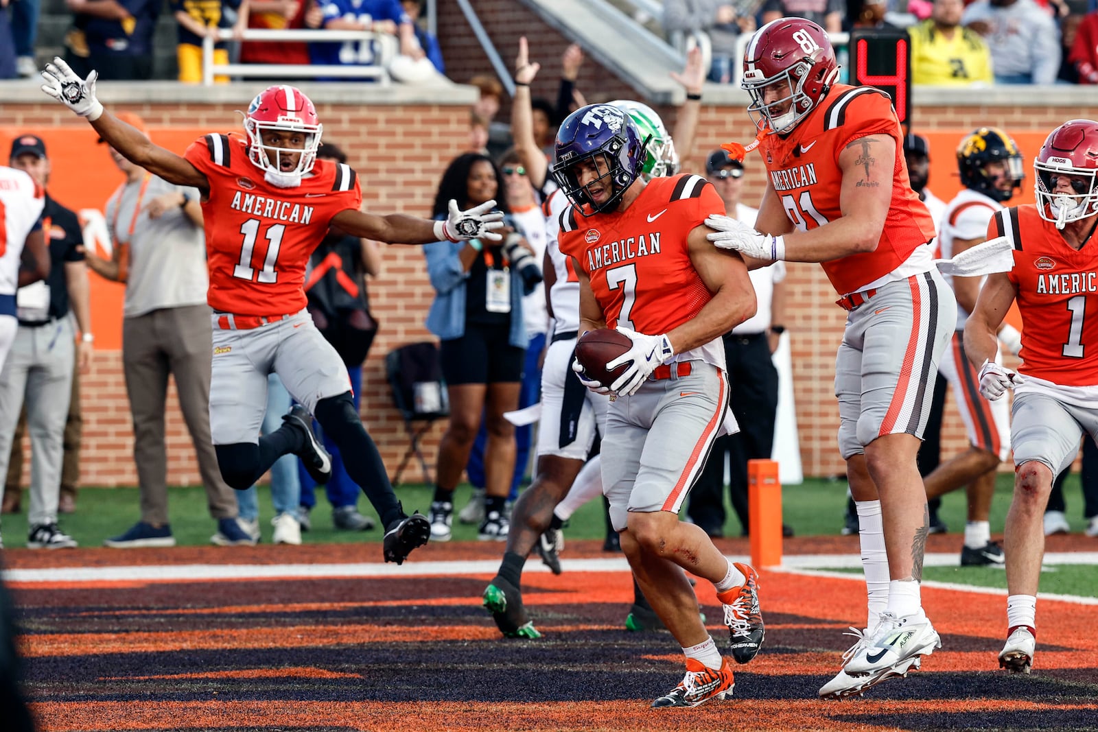 American team wide receiver Jack Bech (7), of TCU, celebrates with teammates after scoring the winning touchdown over the National team during the second half of the Senior Bowl NCAA college football game, Saturday, Feb. 1, 2025, in Mobile, Ala. (AP Photo/Butch Dill)