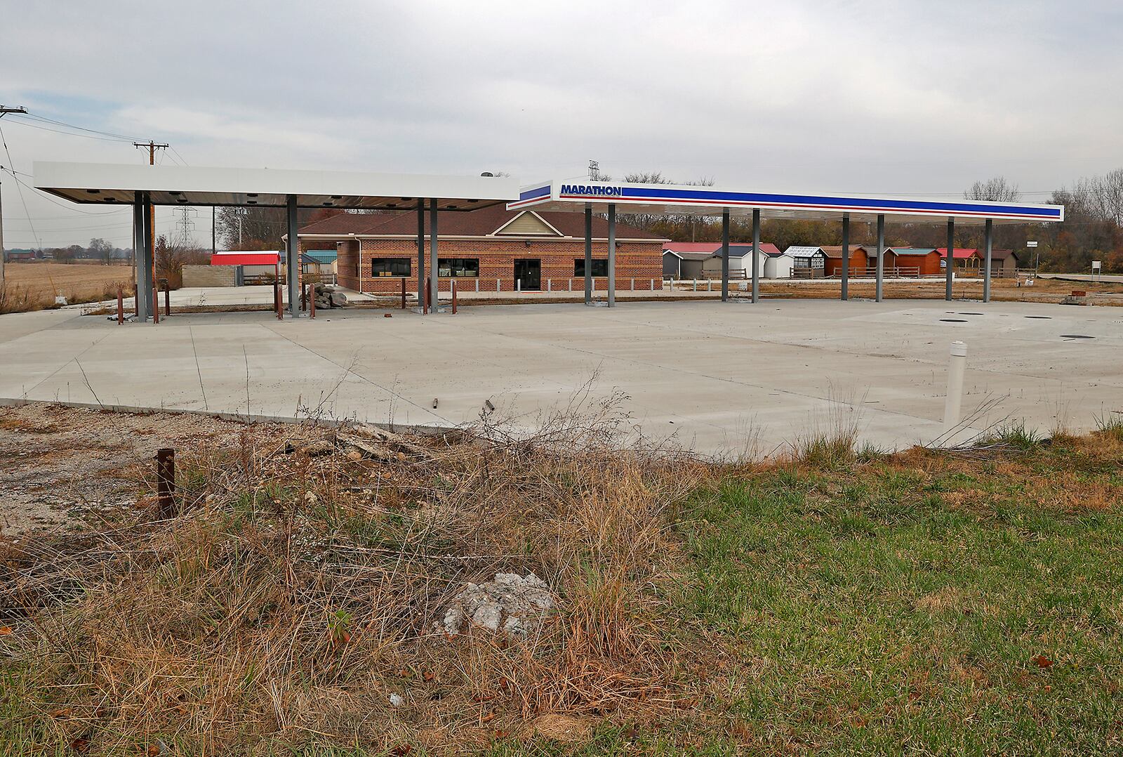 The Marathon gas station at the intersection of U.S. 40 and Ohio 235 in Clark County has been partially completed for over a year. BILL LACKEY/STAFF