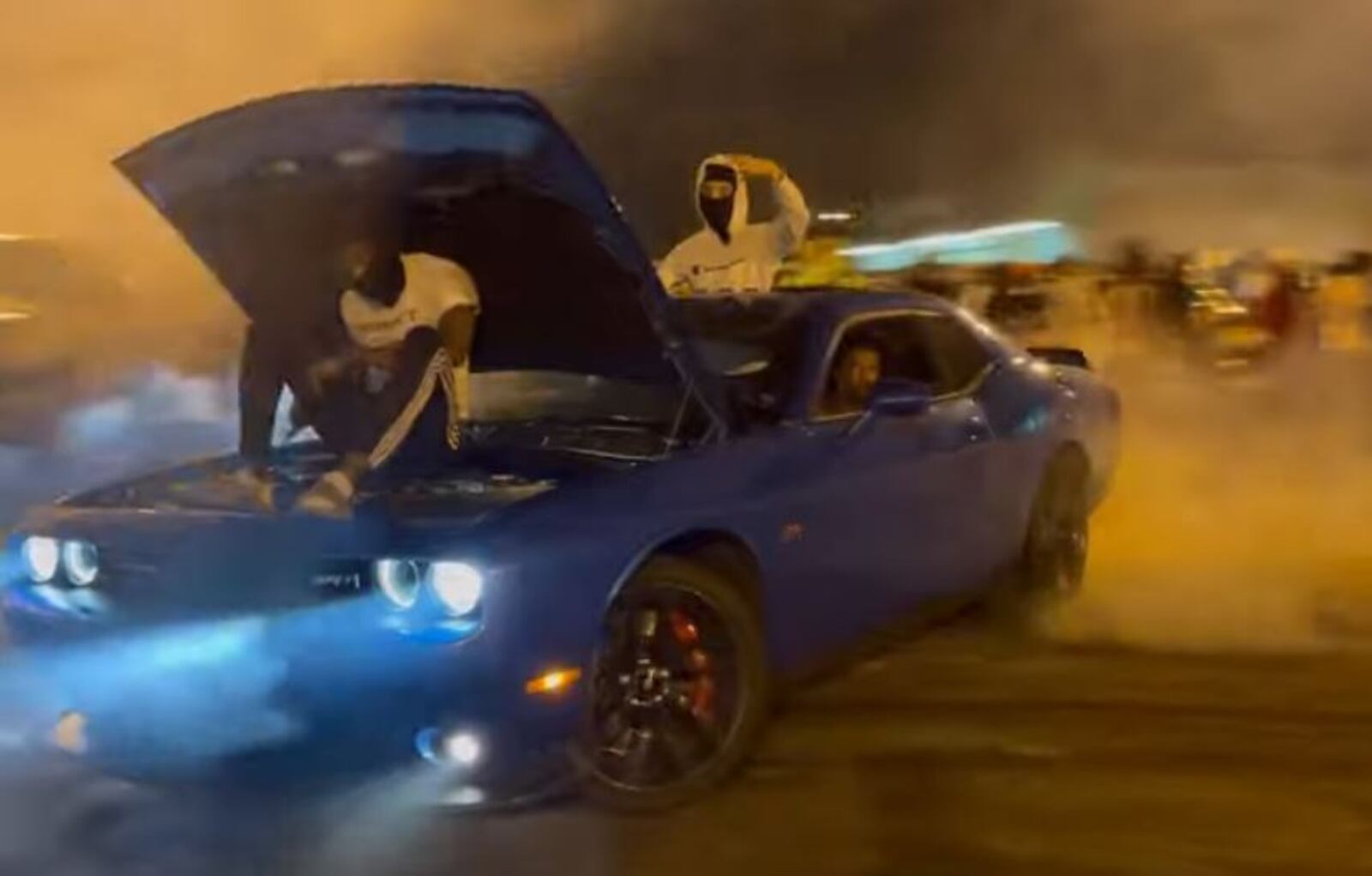 An image from a video showing burnouts, donuts and hooning-type activities in a parking lot of a shopping plaza on Gettysburg Avenue in northwest Dayton. CONTRIBUTED