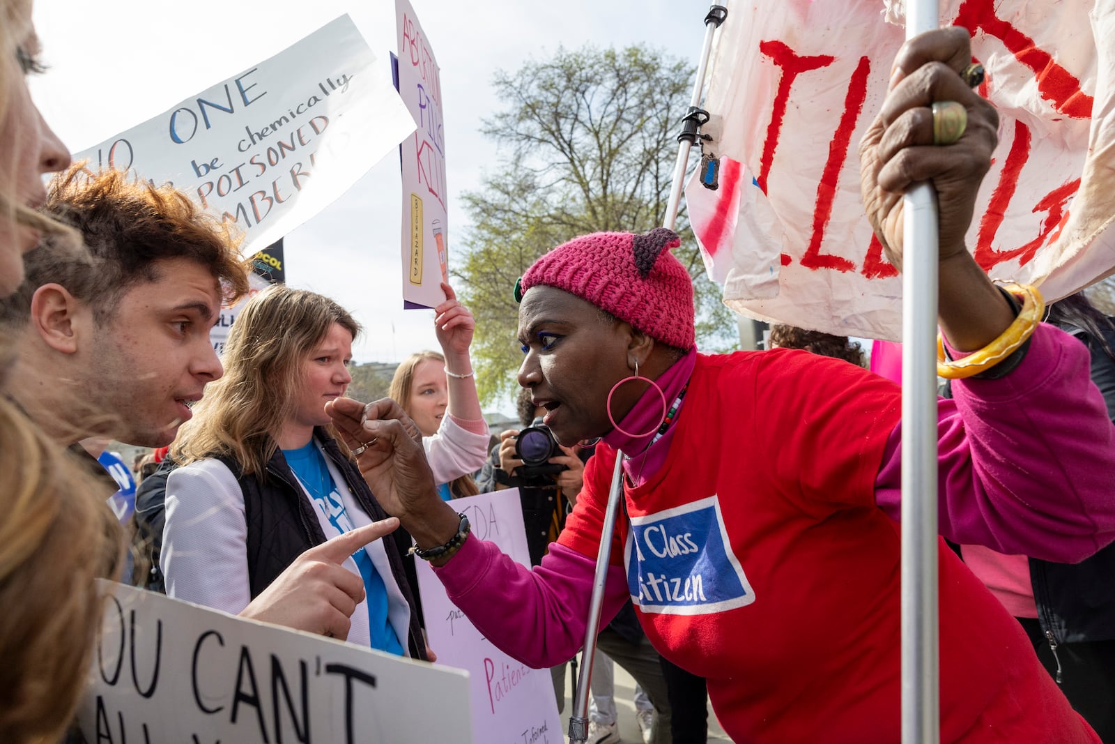 FILE - Anti-abortion activist Caleb Buck, left, argues with abortion-rights activist Nadine Seiler outside the Supreme Court, Tuesday, March 26, 2024, in Washington. (AP Photo/Amanda Andrade-Rhoades, File)