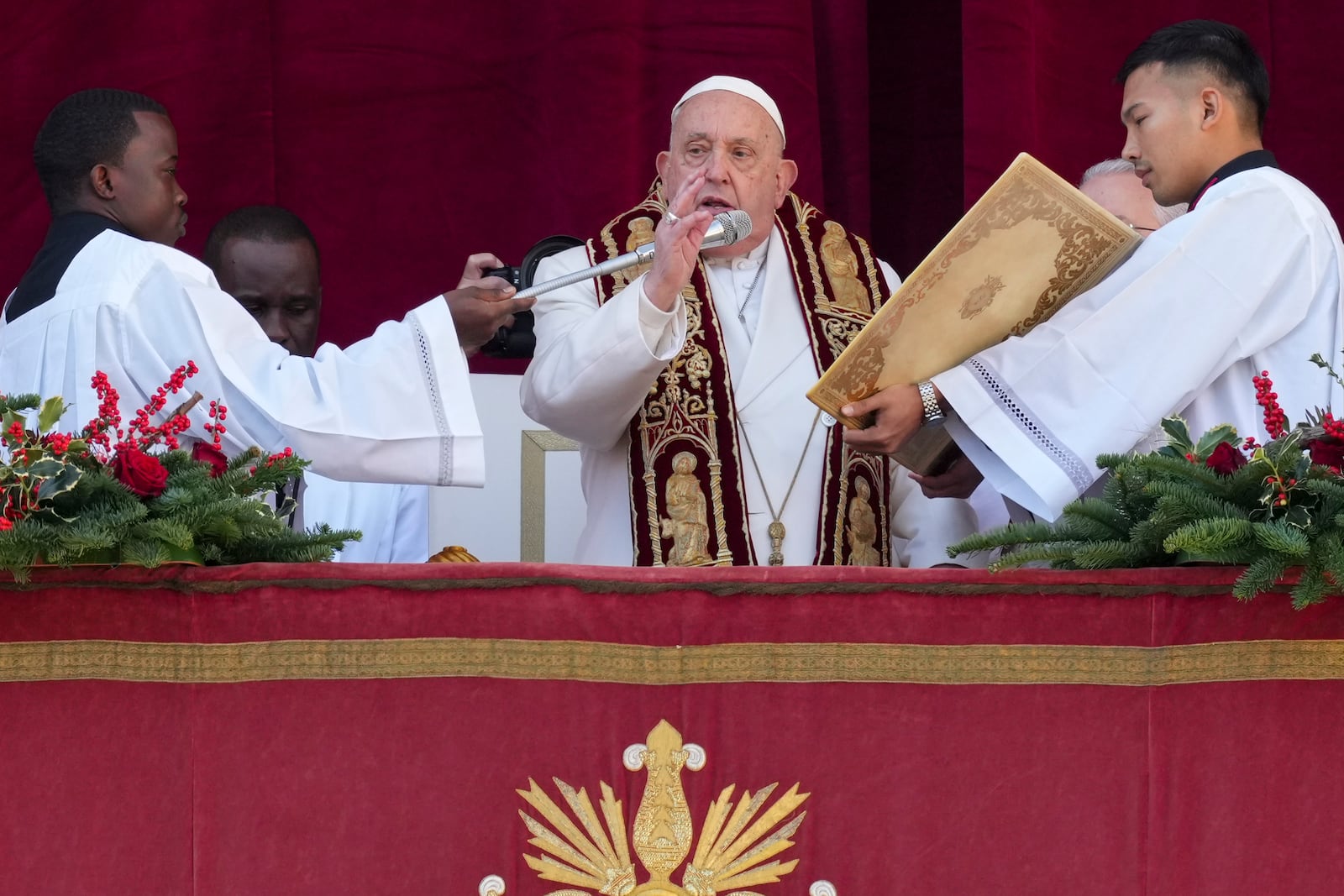 Pope Francis delivers the Urbi et Orbi (Latin for 'to the city and to the world' ) Christmas' day blessing from the main balcony of St. Peter's Basilica at the Vatican, Wednesday, Dec. 25, 2024. (AP Photo/Andrew Medichini)