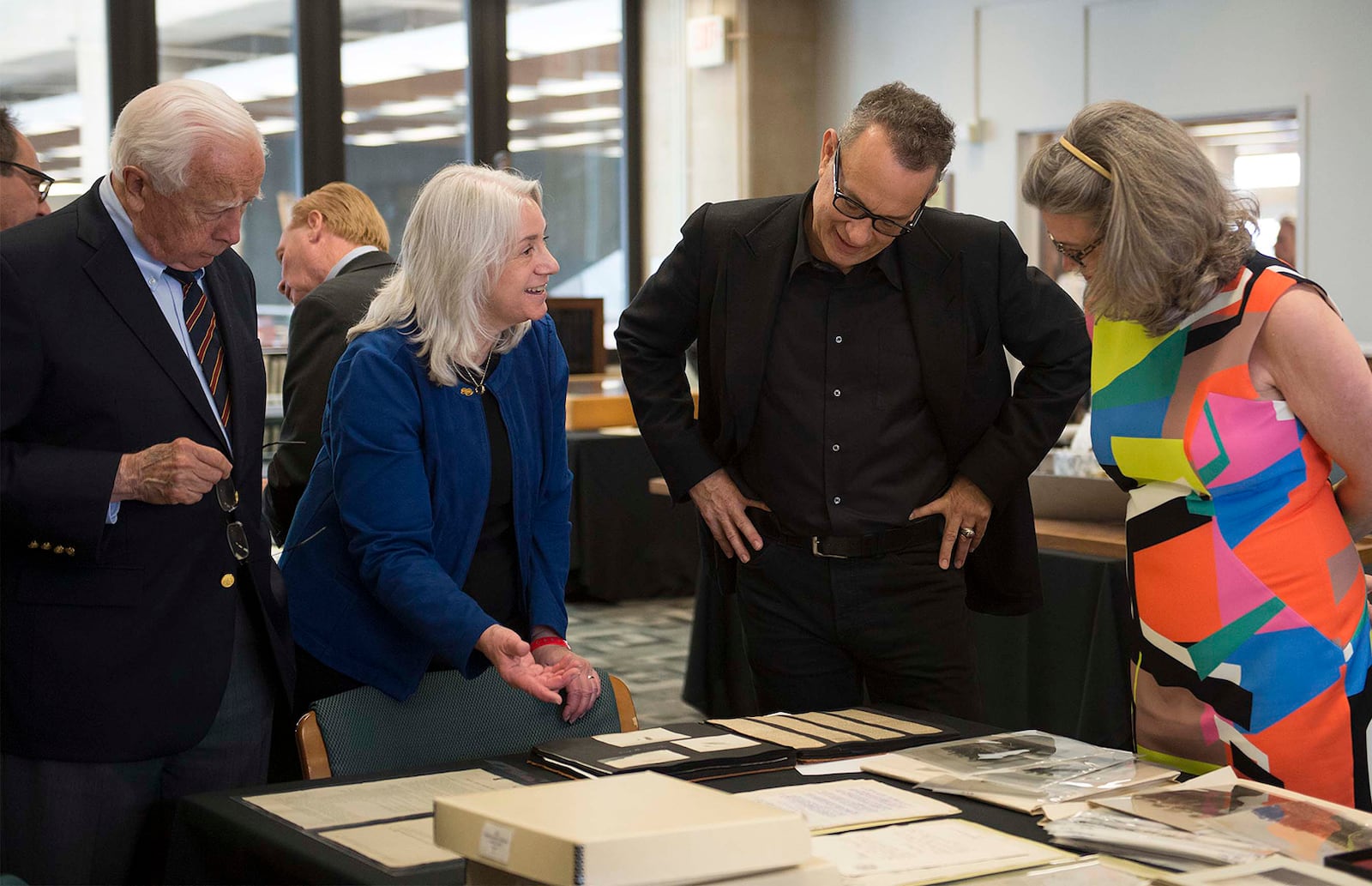 Pulitzer Prize-winning historian David McCullough (from left), Wright State University's Head of Special Collections and Archives Dawne Dewey, Academy Award-winning actor Tom Hanks and Amanda Wright Lane, great- grandniece of the Wright brothers, view some of the Wright brothers artifacts in the Archive's Wright Brothers Collection, one of the most complete collections of Wright material in the world. Photo by Will Jones of Wright State University