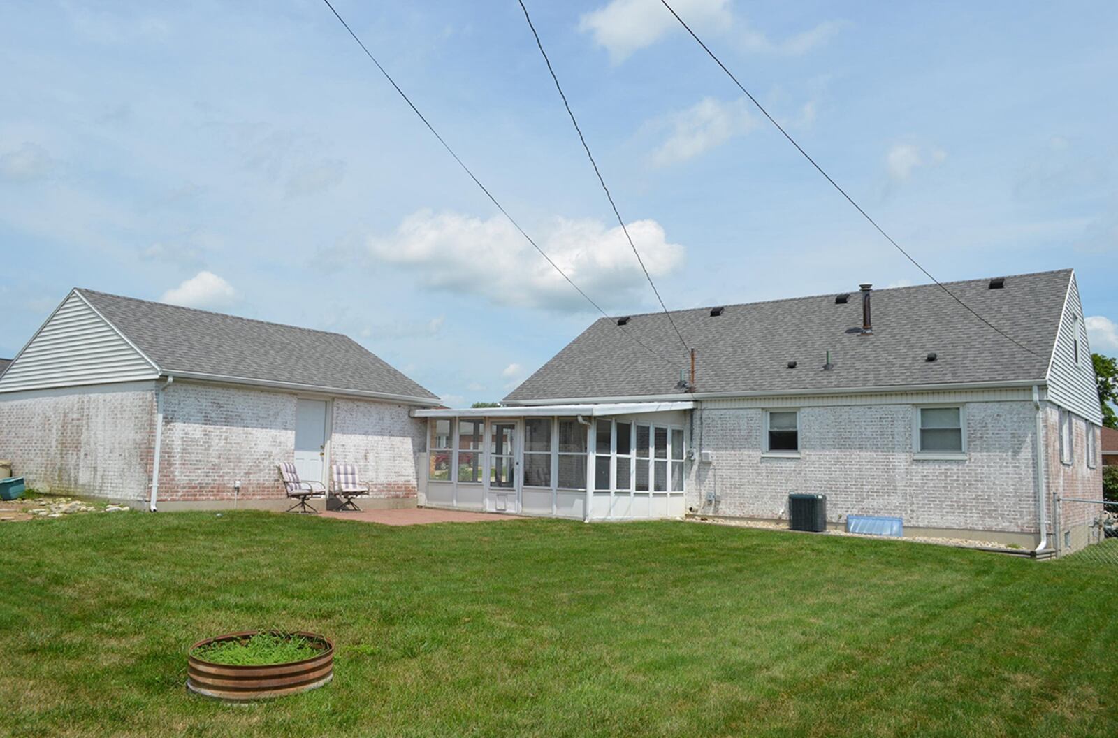 The rear has a Florida room opening to a paver patio and a large back yard with a firepit. CONTRIBUTED PHOTO