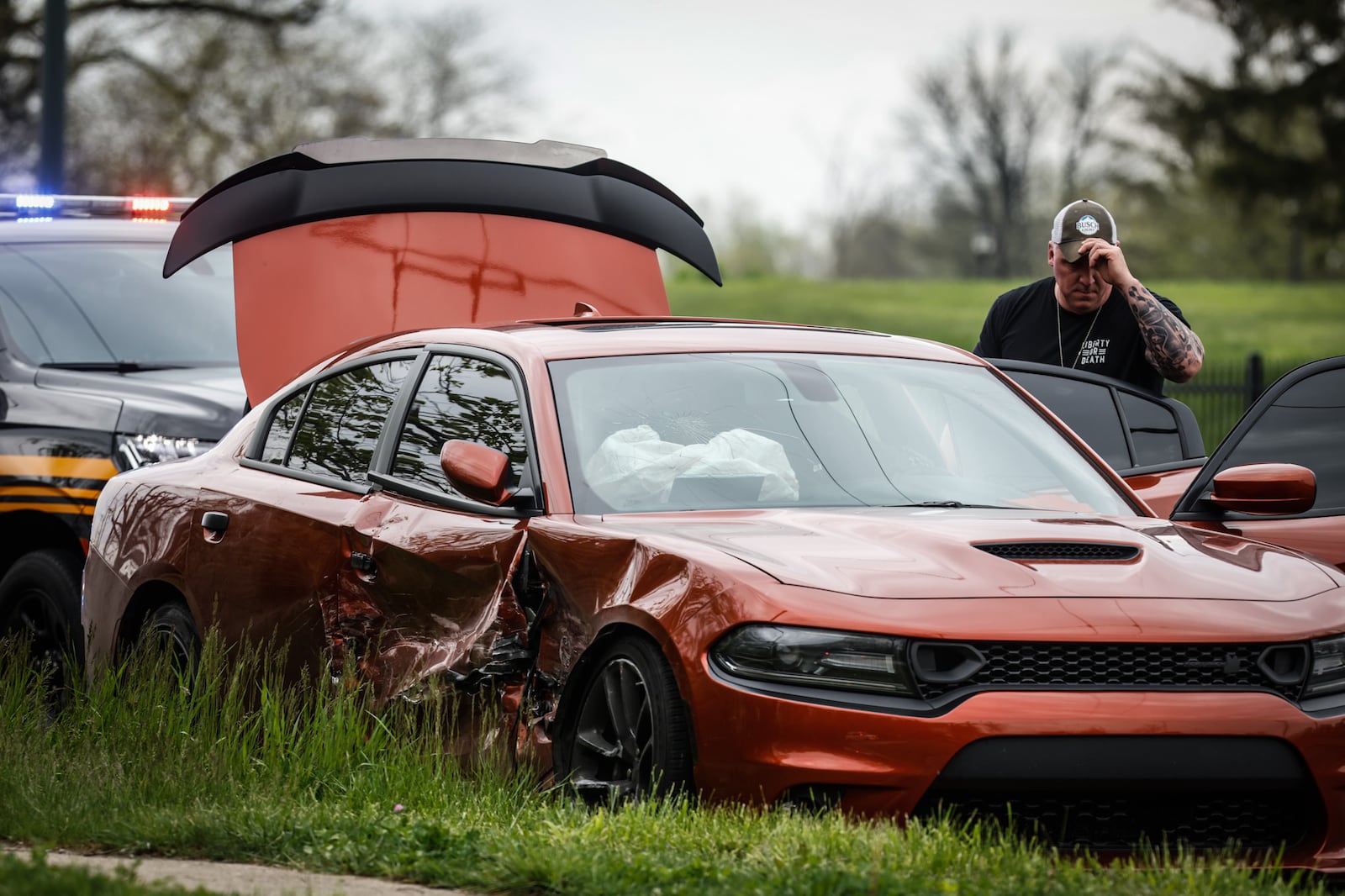 A Dodge Charger reportedly rammed a Dayton police cruiser before its driver was involved in a pursuit that ended with a crash. The driver ran away from the vehicle following the crash on Gettysburg Avenue. JIM NOELKER/STAFF