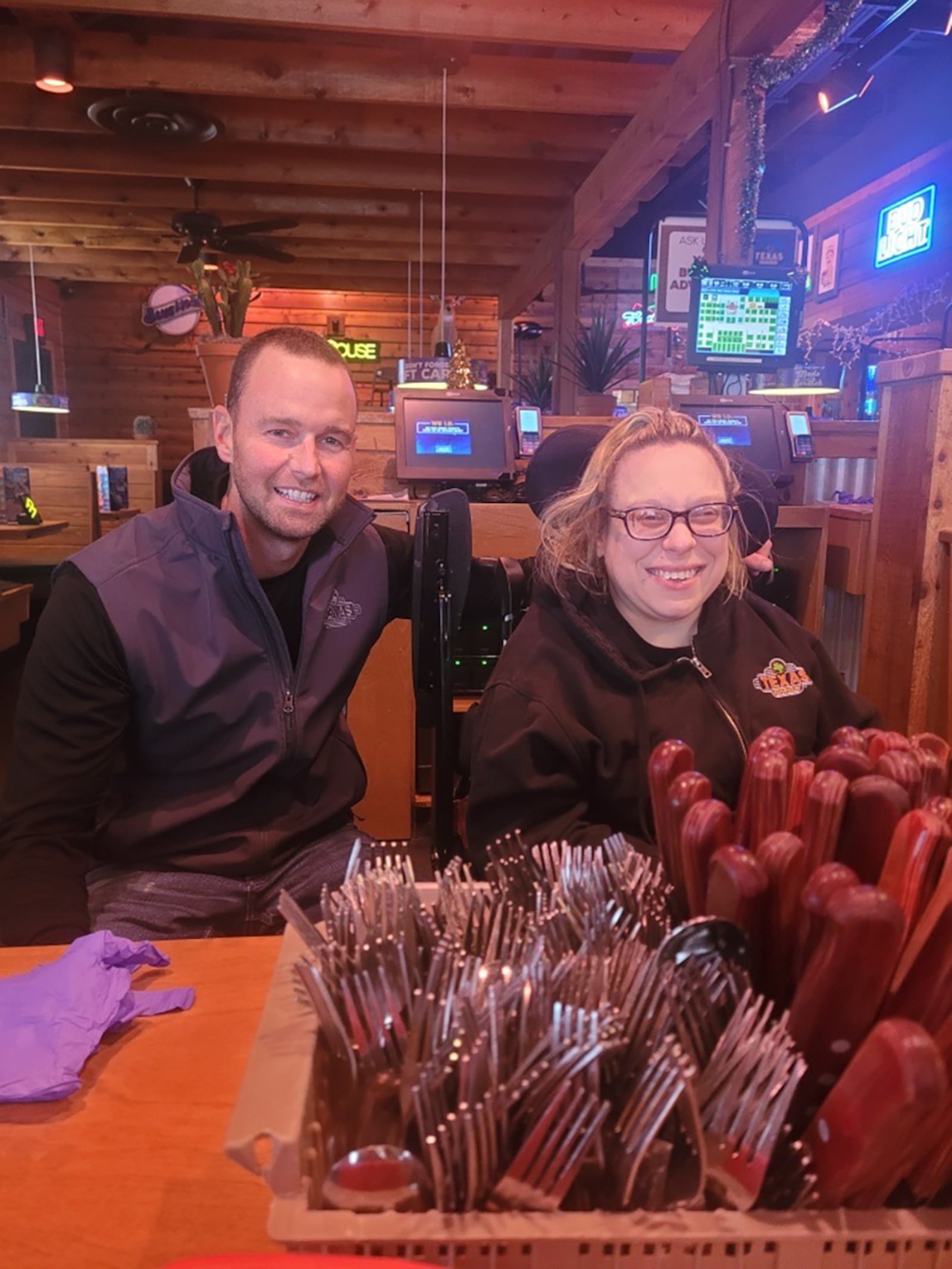 Keenan Carver left, manager at Texas Roadhouse in Fairborn with employee Amy Zahora. Carver praises Zahora's worth ethic. CONTRIBUTED