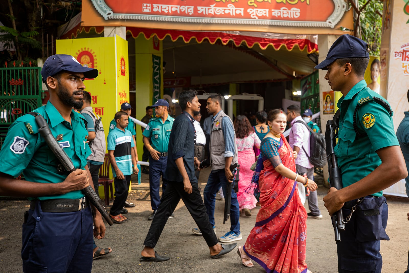 Policemen stand guard outside Dhakeshwari National Temple during the Durgapuja festival in Dhaka, Bangladesh, on Oct. 10, 2024. (AP Photo/Rajib Dhar)