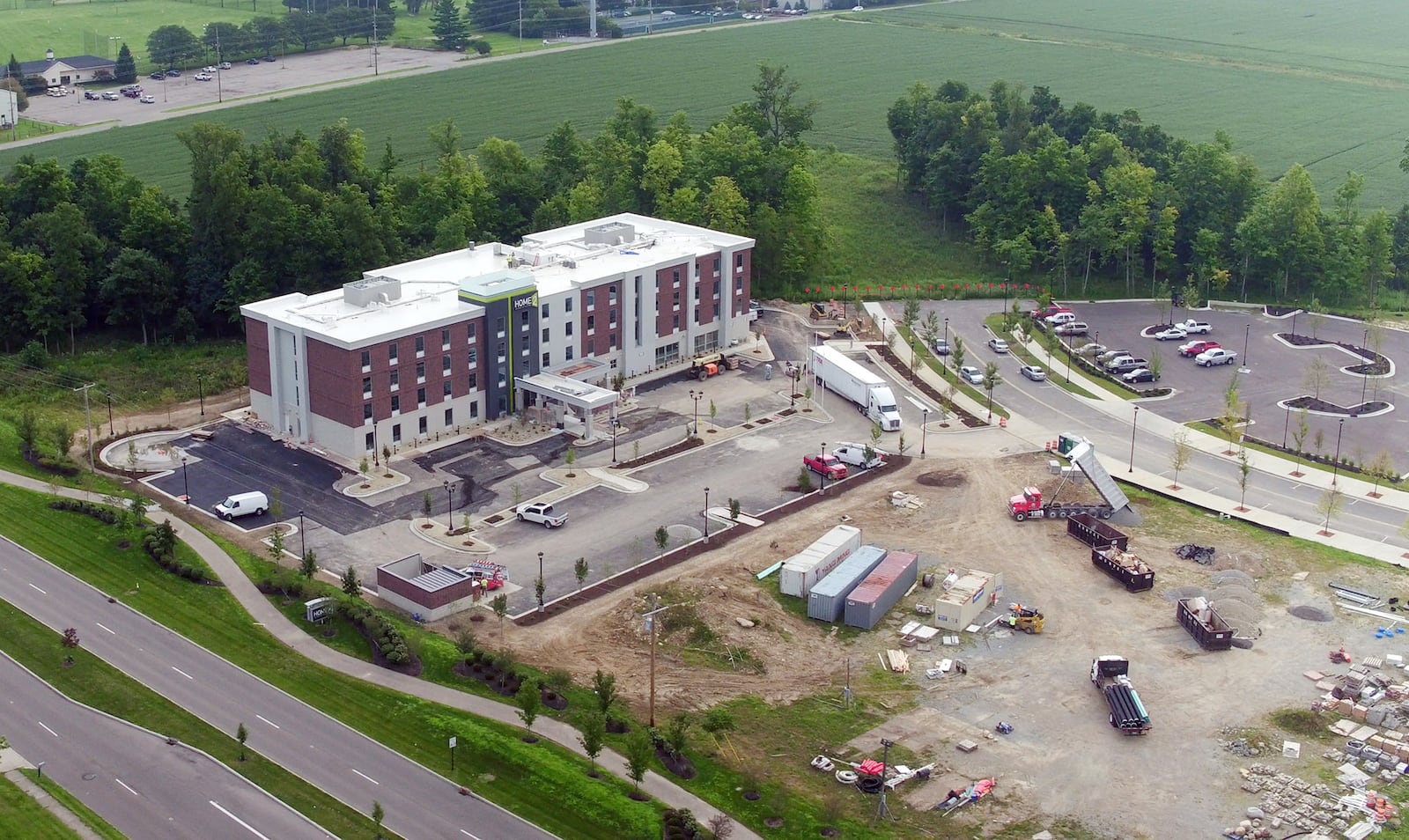 The exterior of the new Home2 Suites by Hilton at Cornerstone appears to be complete and is one of many new construction projects underway along the Wilmington Pike corridor.   TY GREENLEES / STAFF