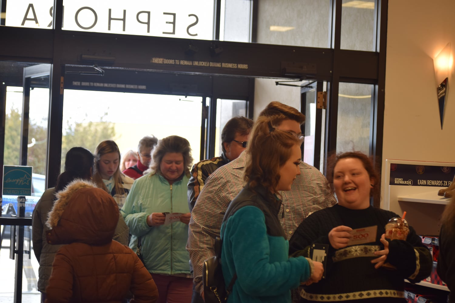 PHOTOS: Hundreds like up outside JCPenney for doorbusters, coupons