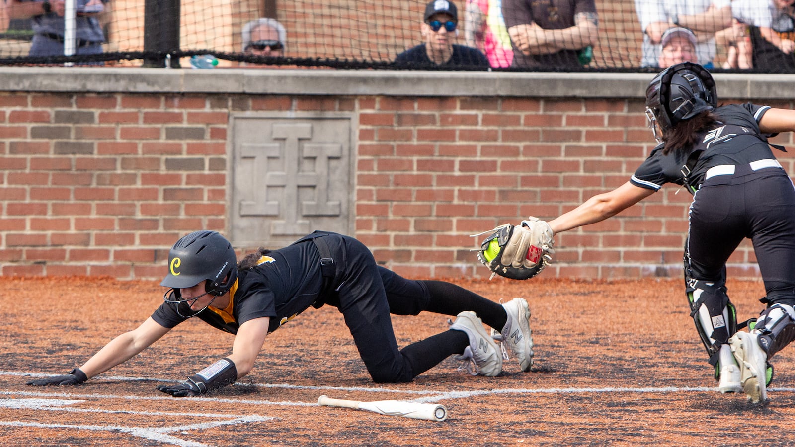 Centerville's Natalie Carr scores on a two-run single by Ardyn Hopf in the fourth inning. The Elks defeated Mason 10-1 to advance to the program's first region final. Jeff Gilbert/CONTRIBUTED