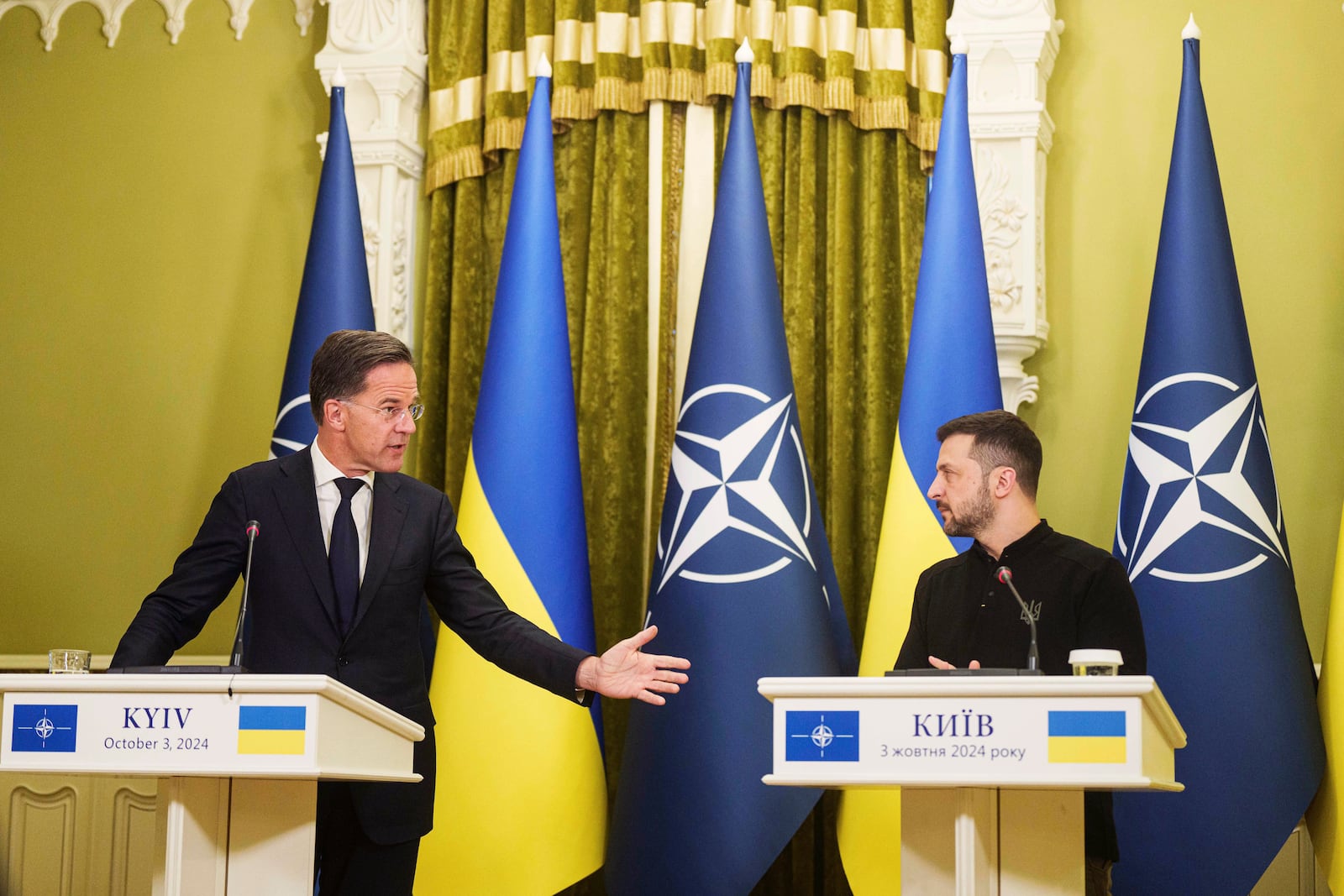 FILE - NATO Secretary General Mark Rutte, left, and Ukrainian President Volodymyr Zelenskyy, speak to journalists during a news conference in Kyiv, Ukraine, on Oct. 3, 2024. (AP Photo/Evgeniy Maloletka, File)